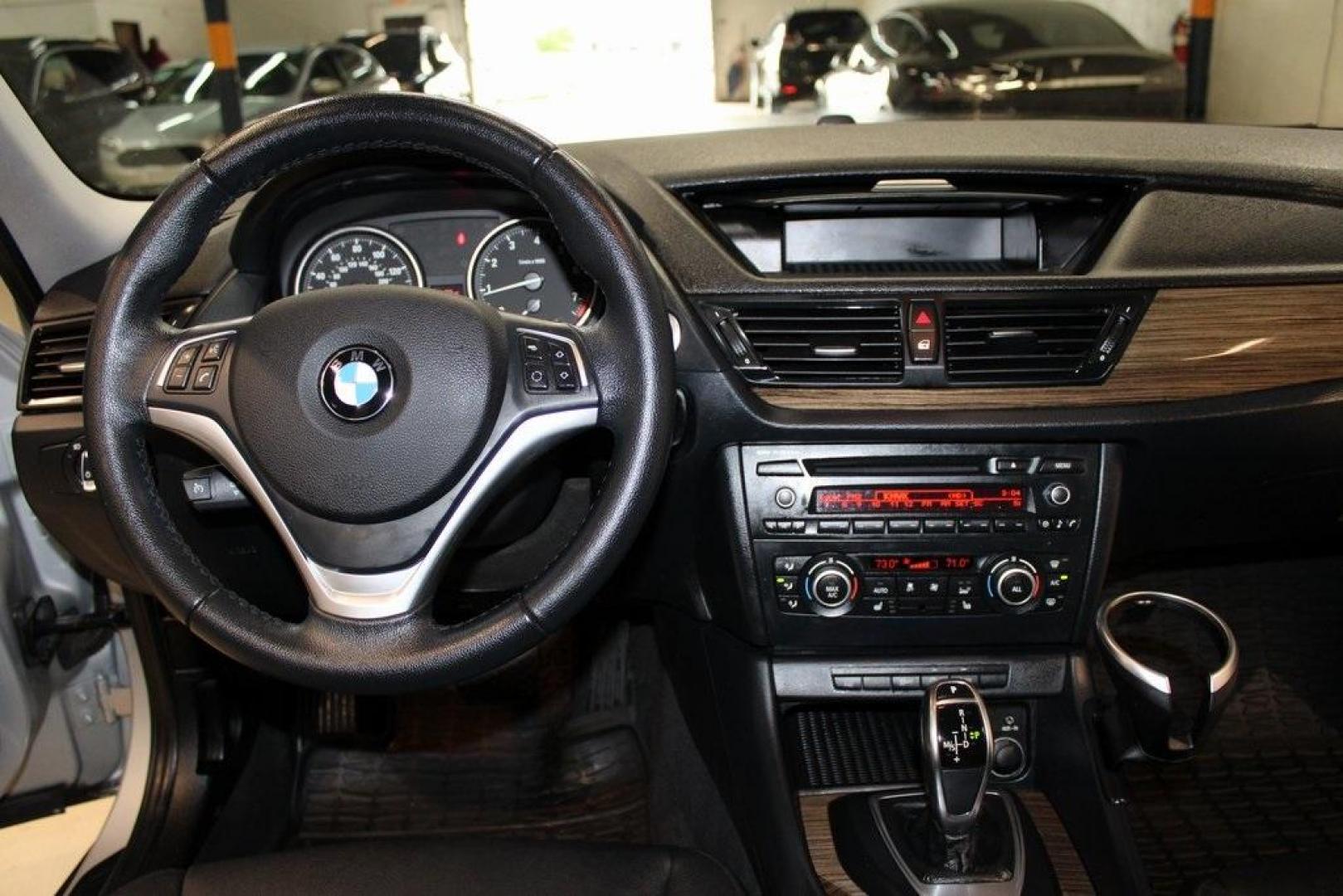 2014 Glacier Silver Metallic /Black BMW X1 xDrive28i (WBAVL1C58EV) with an 2.0L 4-Cylinder DOHC 16V TwinPower Turbo engine, Automatic transmission, located at 15300 Midway Rd., Addison, TX, 75001, (972) 702-0011, 32.958321, -96.838074 - HOME OF THE NO HAGGLE PRICE - WHOLESALE PRICES TO THE PUBLIC!! X1 xDrive28i, 4D Sport Utility, 2.0L 4-Cylinder DOHC 16V TwinPower Turbo, 8-Speed Automatic Steptronic, AWD, Glacier Silver Metallic, Black Leather.<br><br>Glacier Silver Metallic 2014 BMW X1 xDrive28i<br><br>22/33 City/Highway MPG<br><b - Photo#17