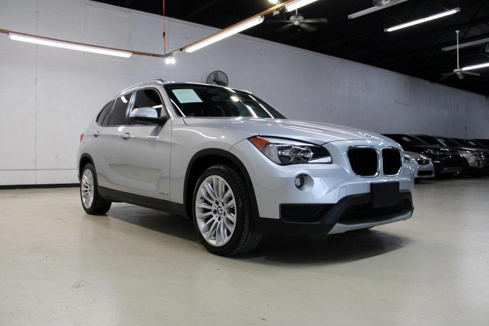 2014 Glacier Silver Metallic /Black BMW X1 xDrive28i (WBAVL1C58EV) with an 2.0L 4-Cylinder DOHC 16V TwinPower Turbo engine, Automatic transmission, located at 15300 Midway Rd., Addison, TX, 75001, (972) 702-0011, 32.958321, -96.838074 - HOME OF THE NO HAGGLE PRICE - WHOLESALE PRICES TO THE PUBLIC!! X1 xDrive28i, 4D Sport Utility, 2.0L 4-Cylinder DOHC 16V TwinPower Turbo, 8-Speed Automatic Steptronic, AWD, Glacier Silver Metallic, Black Leather.<br><br>Glacier Silver Metallic 2014 BMW X1 xDrive28i<br><br>22/33 City/Highway MPG<br><b - Photo#1