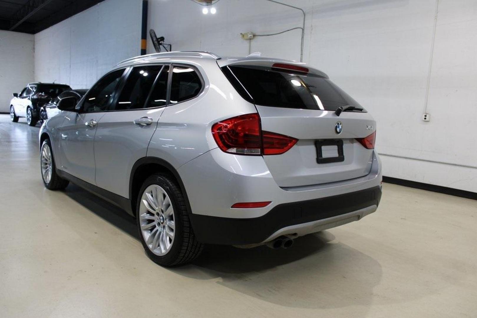 2014 Glacier Silver Metallic /Black BMW X1 xDrive28i (WBAVL1C58EV) with an 2.0L 4-Cylinder DOHC 16V TwinPower Turbo engine, Automatic transmission, located at 15300 Midway Rd., Addison, TX, 75001, (972) 702-0011, 32.958321, -96.838074 - HOME OF THE NO HAGGLE PRICE - WHOLESALE PRICES TO THE PUBLIC!! X1 xDrive28i, 4D Sport Utility, 2.0L 4-Cylinder DOHC 16V TwinPower Turbo, 8-Speed Automatic Steptronic, AWD, Glacier Silver Metallic, Black Leather.<br><br>Glacier Silver Metallic 2014 BMW X1 xDrive28i<br><br>22/33 City/Highway MPG<br><b - Photo#3