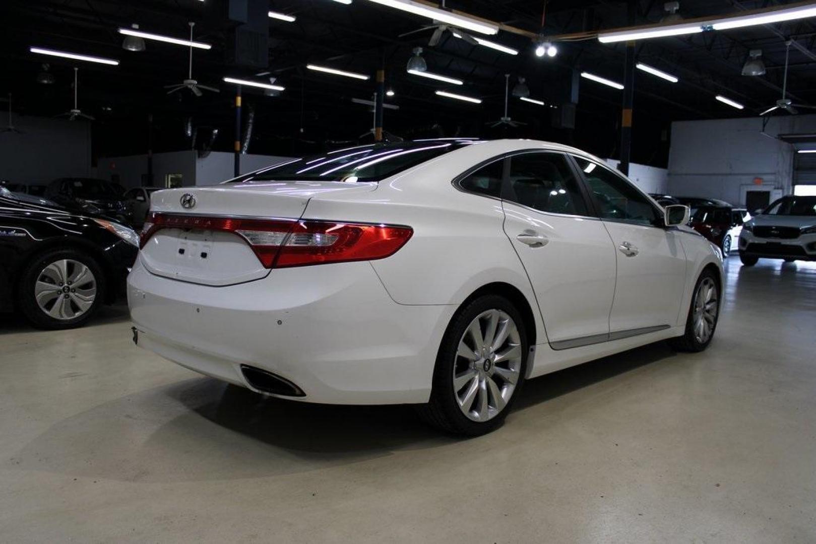 2013 Porcelain White Pearl /Graphite Hyundai Azera Base (KMHFH4JG1DA) with an 3.3L V6 DGI DOHC Variable Intake System engine, Automatic transmission, located at 15300 Midway Rd., Addison, TX, 75001, (972) 702-0011, 32.958321, -96.838074 - HOME OF THE NO HAGGLE PRICE - WHOLESALE PRICES TO THE PUBLIC!! 4D Sedan, 3.3L V6 DGI DOHC Variable Intake System, 6-Speed Automatic with Shiftronic, FWD, Porcelain White Pearl, Graphite Leather.<br><br>Porcelain White Pearl 2013 Hyundai Azera<br><br>Recent Arrival! 20/29 City/Highway MPG<br><br>Awar - Photo#1