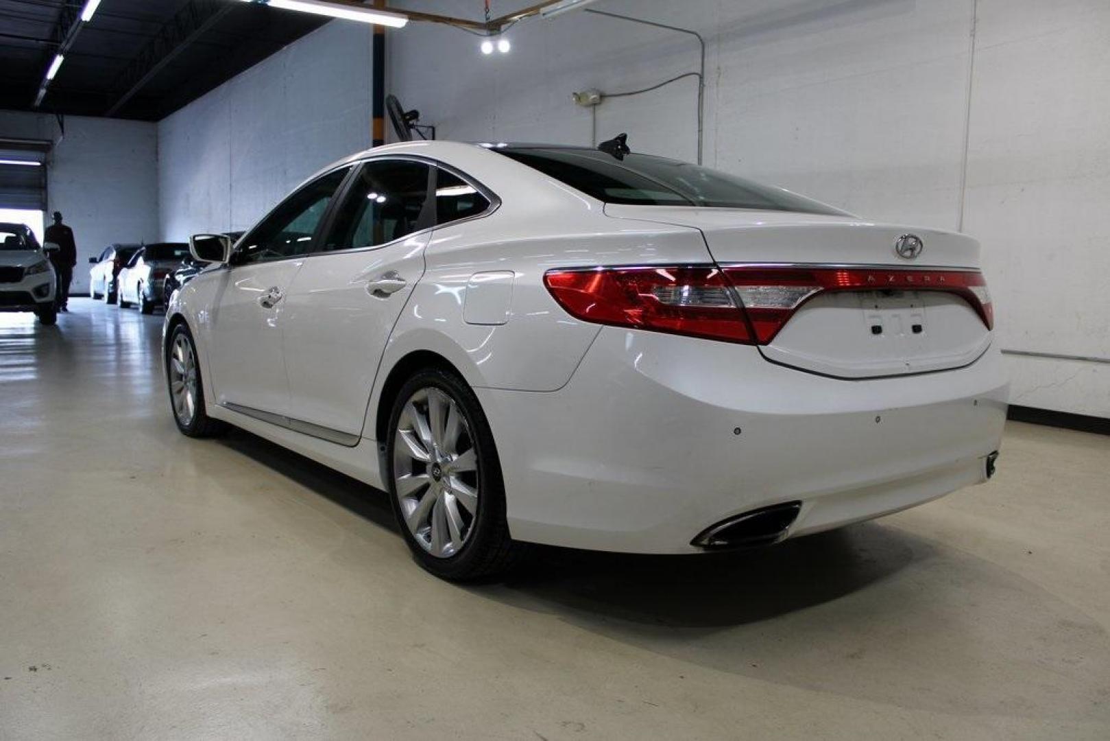 2013 Porcelain White Pearl /Graphite Hyundai Azera Base (KMHFH4JG1DA) with an 3.3L V6 DGI DOHC Variable Intake System engine, Automatic transmission, located at 15300 Midway Rd., Addison, TX, 75001, (972) 702-0011, 32.958321, -96.838074 - HOME OF THE NO HAGGLE PRICE - WHOLESALE PRICES TO THE PUBLIC!! 4D Sedan, 3.3L V6 DGI DOHC Variable Intake System, 6-Speed Automatic with Shiftronic, FWD, Porcelain White Pearl, Graphite Leather.<br><br>Porcelain White Pearl 2013 Hyundai Azera<br><br>Recent Arrival! 20/29 City/Highway MPG<br><br>Awar - Photo#2