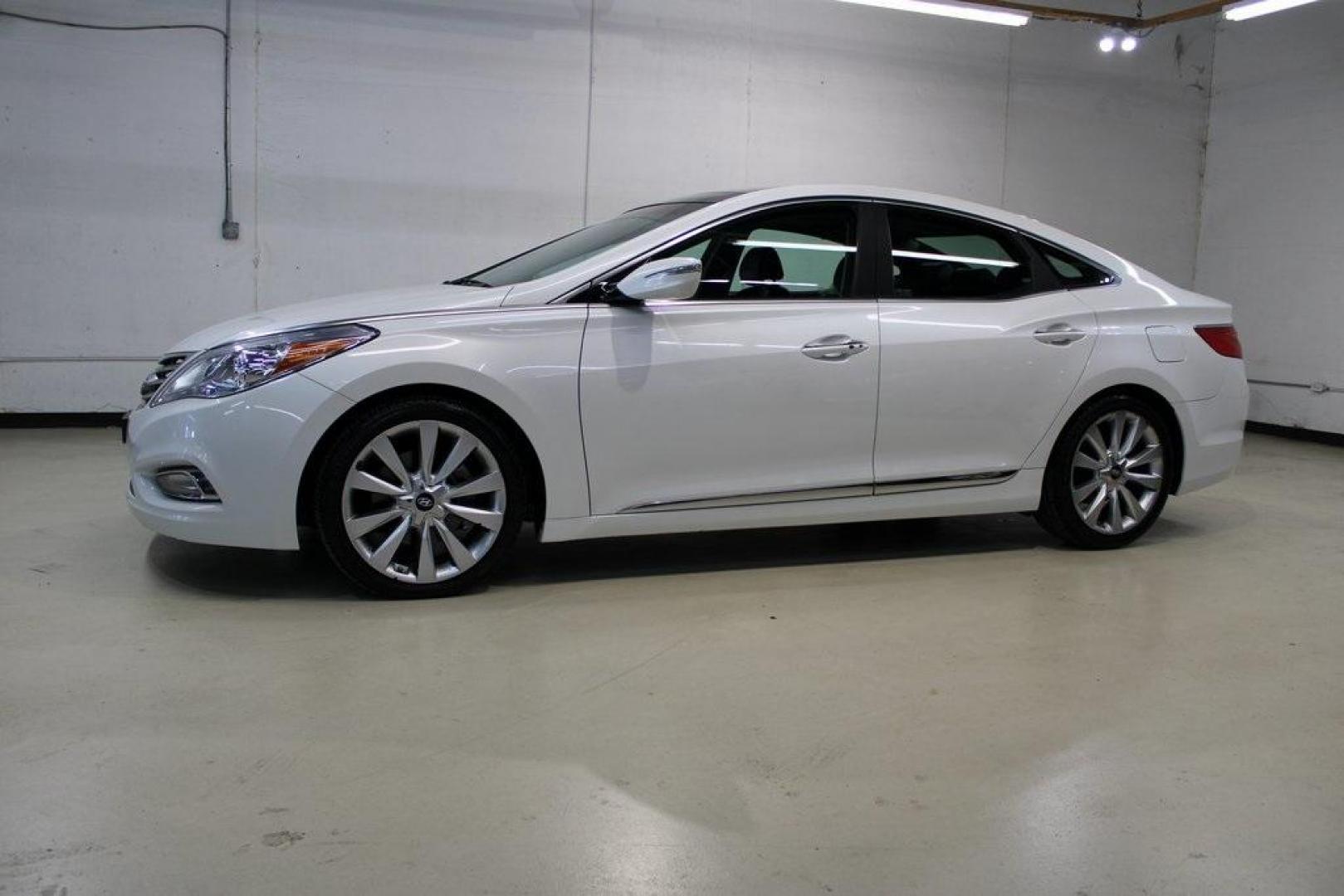 2013 Porcelain White Pearl /Graphite Hyundai Azera Base (KMHFH4JG1DA) with an 3.3L V6 DGI DOHC Variable Intake System engine, Automatic transmission, located at 15300 Midway Rd., Addison, TX, 75001, (972) 702-0011, 32.958321, -96.838074 - HOME OF THE NO HAGGLE PRICE - WHOLESALE PRICES TO THE PUBLIC!! 4D Sedan, 3.3L V6 DGI DOHC Variable Intake System, 6-Speed Automatic with Shiftronic, FWD, Porcelain White Pearl, Graphite Leather.<br><br>Porcelain White Pearl 2013 Hyundai Azera<br><br>Recent Arrival! 20/29 City/Highway MPG<br><br>Awar - Photo#3