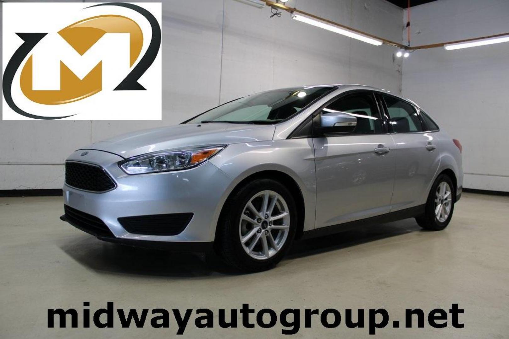 2016 Ingot Silver /Charcoal Black Ford Focus SE (1FADP3F27GL) with an I4 engine, Automatic transmission, located at 15300 Midway Rd., Addison, TX, 75001, (972) 702-0011, 32.958321, -96.838074 - HOME OF THE NO HAGGLE PRICE - WHOLESALE PRICES TO THE PUBLIC!! Focus SE, 4D Sedan, I4, 6-Speed Automatic with Powershift, FWD, Ingot Silver, Charcoal Black Cloth.<br><br>Ingot Silver 2016 Ford Focus SE<br><br>27/40 City/Highway MPG<br><br>Awards:<br> * 2016 KBB.com Brand Image Awards<br><br>At Midw - Photo#0