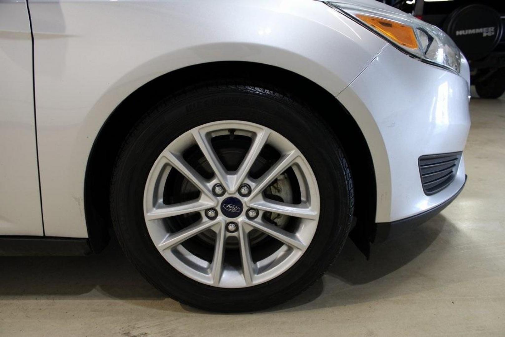 2016 Ingot Silver /Charcoal Black Ford Focus SE (1FADP3F27GL) with an I4 engine, Automatic transmission, located at 15300 Midway Rd., Addison, TX, 75001, (972) 702-0011, 32.958321, -96.838074 - HOME OF THE NO HAGGLE PRICE - WHOLESALE PRICES TO THE PUBLIC!! Focus SE, 4D Sedan, I4, 6-Speed Automatic with Powershift, FWD, Ingot Silver, Charcoal Black Cloth.<br><br>Ingot Silver 2016 Ford Focus SE<br><br>27/40 City/Highway MPG<br><br>Awards:<br> * 2016 KBB.com Brand Image Awards<br><br>At Midw - Photo#11