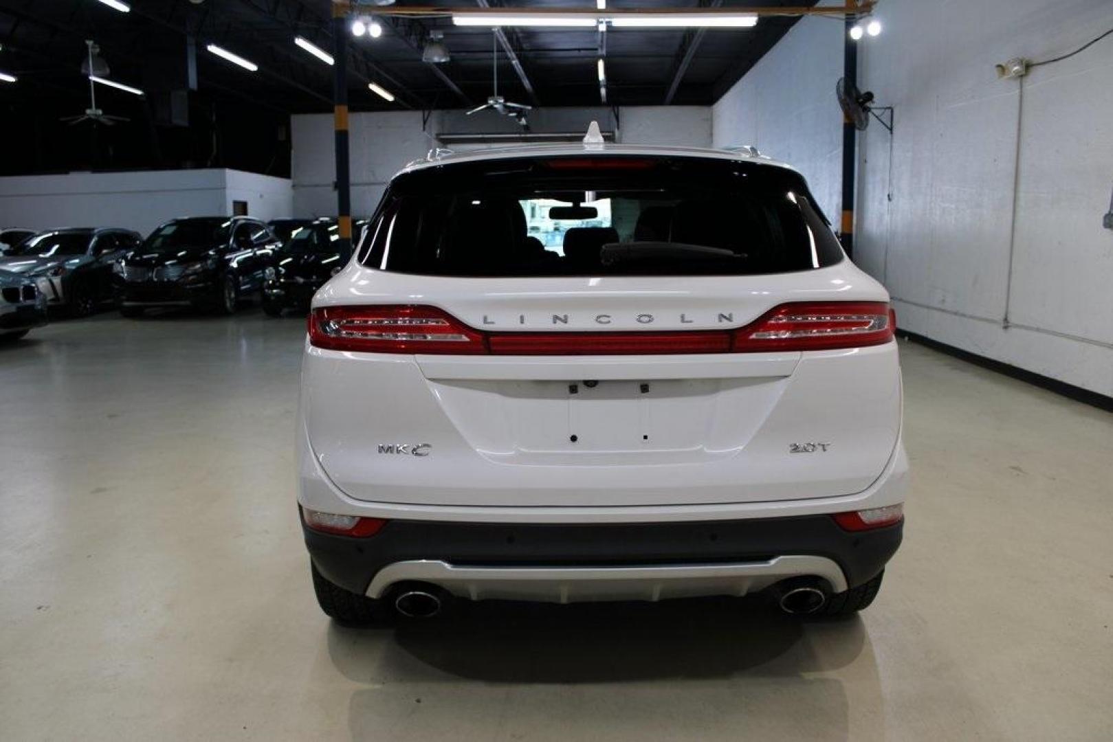 2017 White Platinum Metallic Tri-Coat /Jet Black Lincoln MKC Reserve (5LMCJ3C9XHU) with an 2.0L GTDi engine, Automatic transmission, located at 15300 Midway Rd., Addison, TX, 75001, (972) 702-0011, 32.958321, -96.838074 - HOME OF THE NO HAGGLE PRICE - WHOLESALE PRICES TO THE PUBLIC!! Bluetooth, Hands Free Connectivity, Navigation, Backup Camera, Leather Seats, Sunroof / Moonroof, Power Liftgate, MKC Reserve, 4D Sport Utility, 2.0L GTDi, 6-Speed Automatic, FWD, White, Jet Black Leather.<br><br>White 2017 Lincoln MKC R - Photo#7