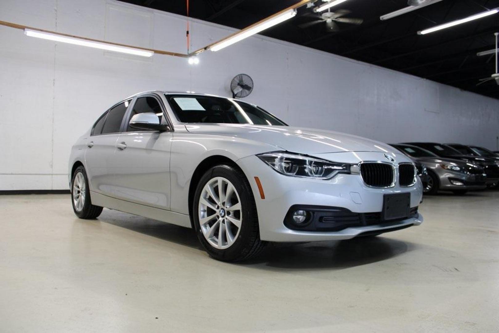 2018 Glacier Silver Metallic /Black BMW 3 Series 320i (WBA8E1G52JN) with an 2.0L 4-Cylinder DOHC 16V TwinPower Turbo engine, Automatic transmission, located at 15300 Midway Rd., Addison, TX, 75001, (972) 702-0011, 32.958321, -96.838074 - HOME OF THE NO HAGGLE PRICE - WHOLESALE PRICES TO THE PUBLIC!! 320i, 4D Sedan, 2.0L 4-Cylinder DOHC 16V TwinPower Turbo, 8-Speed Automatic, RWD, Glacier Silver Metallic, Black Artificial Leather.<br><br>Glacier Silver Metallic 2018 BMW 3 Series 320i<br><br>Recent Arrival! 24/35 City/Highway MPG<br>< - Photo#1