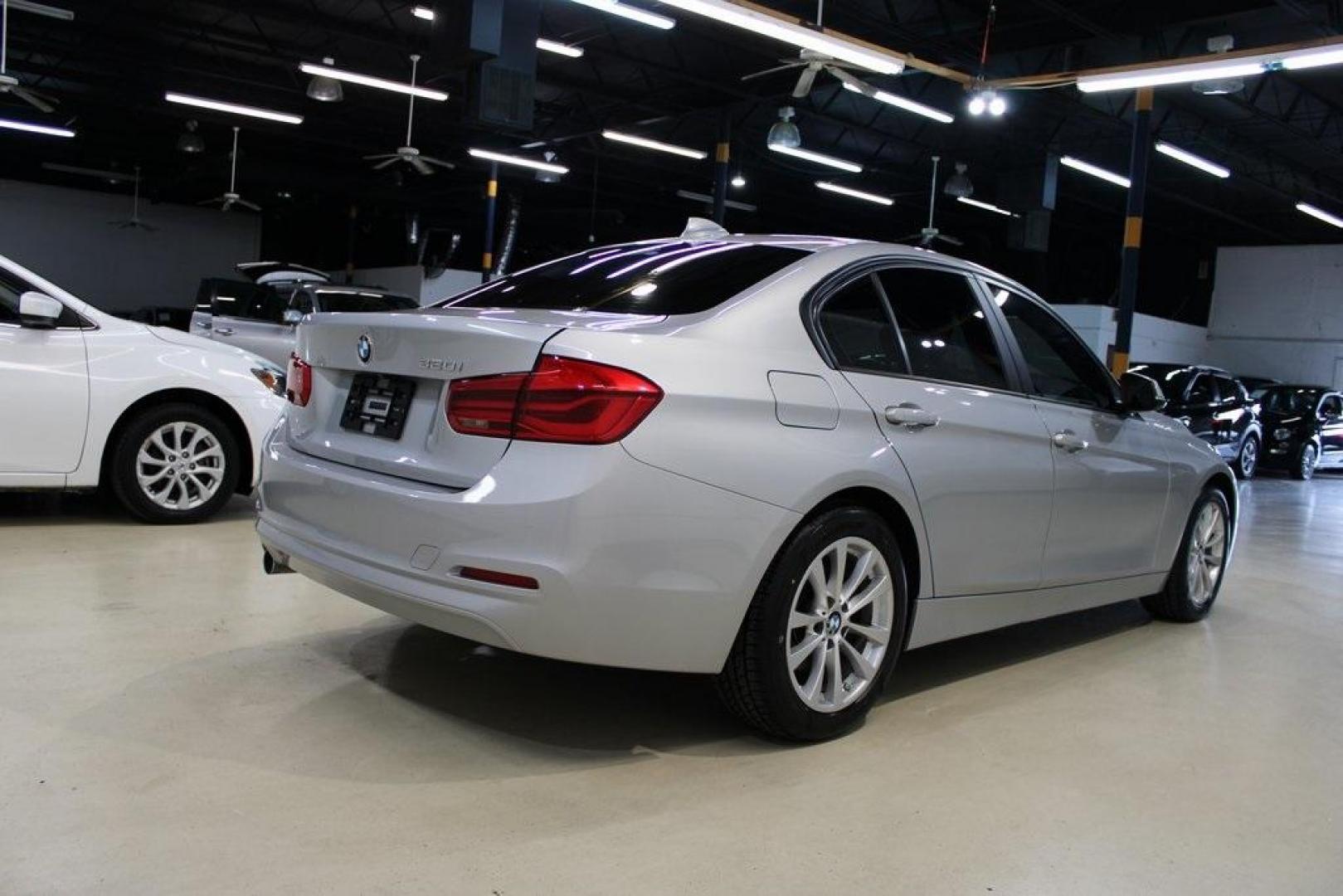 2018 Glacier Silver Metallic /Black BMW 3 Series 320i (WBA8E1G52JN) with an 2.0L 4-Cylinder DOHC 16V TwinPower Turbo engine, Automatic transmission, located at 15300 Midway Rd., Addison, TX, 75001, (972) 702-0011, 32.958321, -96.838074 - HOME OF THE NO HAGGLE PRICE - WHOLESALE PRICES TO THE PUBLIC!! 320i, 4D Sedan, 2.0L 4-Cylinder DOHC 16V TwinPower Turbo, 8-Speed Automatic, RWD, Glacier Silver Metallic, Black Artificial Leather.<br><br>Glacier Silver Metallic 2018 BMW 3 Series 320i<br><br>Recent Arrival! 24/35 City/Highway MPG<br>< - Photo#2