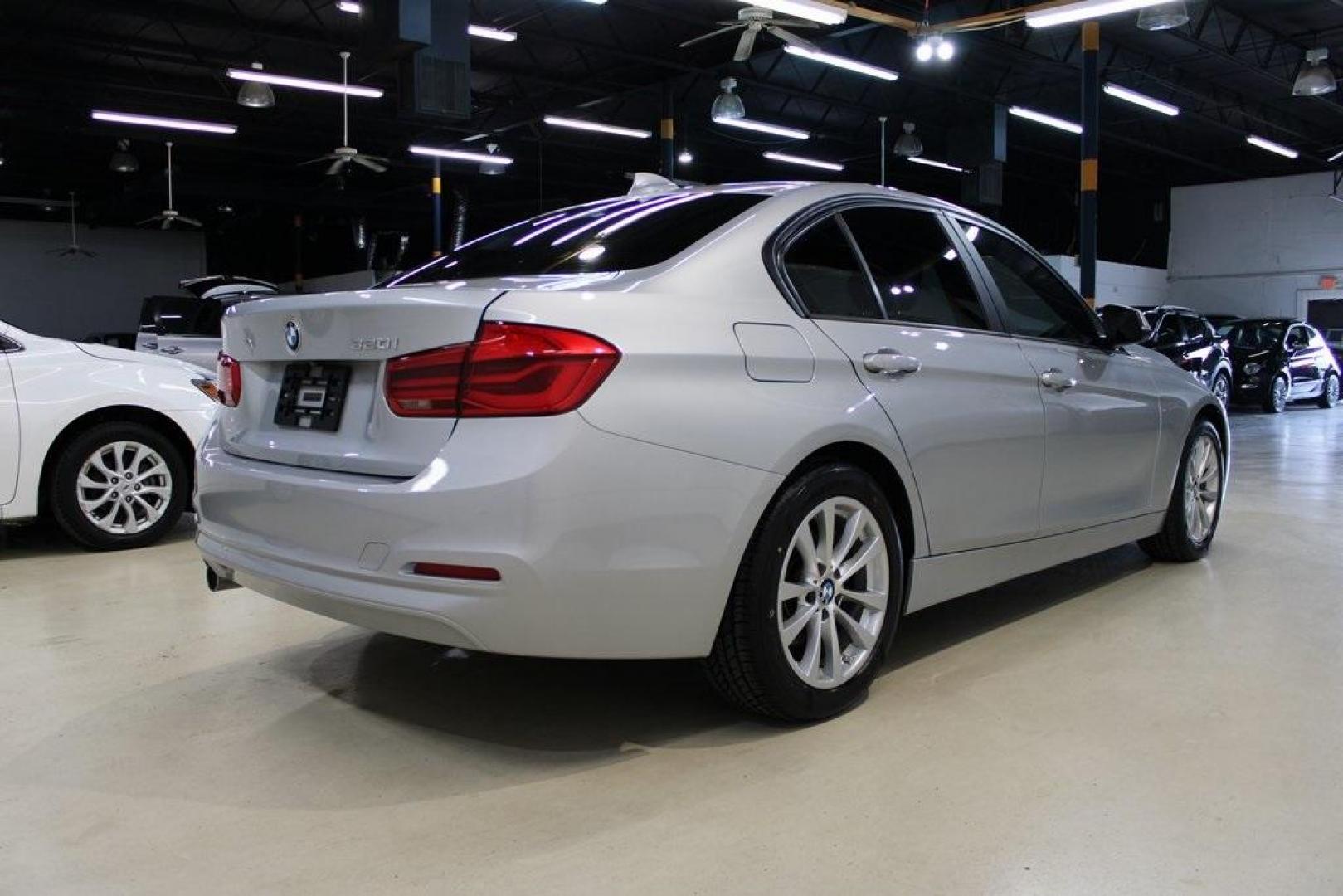 2018 Glacier Silver Metallic /Black BMW 3 Series 320i (WBA8E1G52JN) with an 2.0L 4-Cylinder DOHC 16V TwinPower Turbo engine, Automatic transmission, located at 15300 Midway Rd., Addison, TX, 75001, (972) 702-0011, 32.958321, -96.838074 - HOME OF THE NO HAGGLE PRICE - WHOLESALE PRICES TO THE PUBLIC!! 320i, 4D Sedan, 2.0L 4-Cylinder DOHC 16V TwinPower Turbo, 8-Speed Automatic, RWD, Glacier Silver Metallic, Black Artificial Leather.<br><br>Glacier Silver Metallic 2018 BMW 3 Series 320i<br><br>Recent Arrival! 24/35 City/Highway MPG<br>< - Photo#3