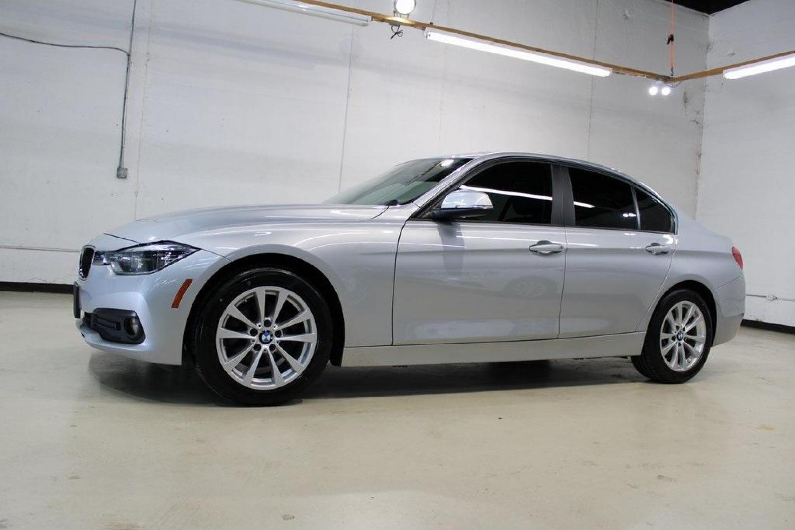 2018 Glacier Silver Metallic /Black BMW 3 Series 320i (WBA8E1G52JN) with an 2.0L 4-Cylinder DOHC 16V TwinPower Turbo engine, Automatic transmission, located at 15300 Midway Rd., Addison, TX, 75001, (972) 702-0011, 32.958321, -96.838074 - HOME OF THE NO HAGGLE PRICE - WHOLESALE PRICES TO THE PUBLIC!! 320i, 4D Sedan, 2.0L 4-Cylinder DOHC 16V TwinPower Turbo, 8-Speed Automatic, RWD, Glacier Silver Metallic, Black Artificial Leather.<br><br>Glacier Silver Metallic 2018 BMW 3 Series 320i<br><br>Recent Arrival! 24/35 City/Highway MPG<br>< - Photo#5