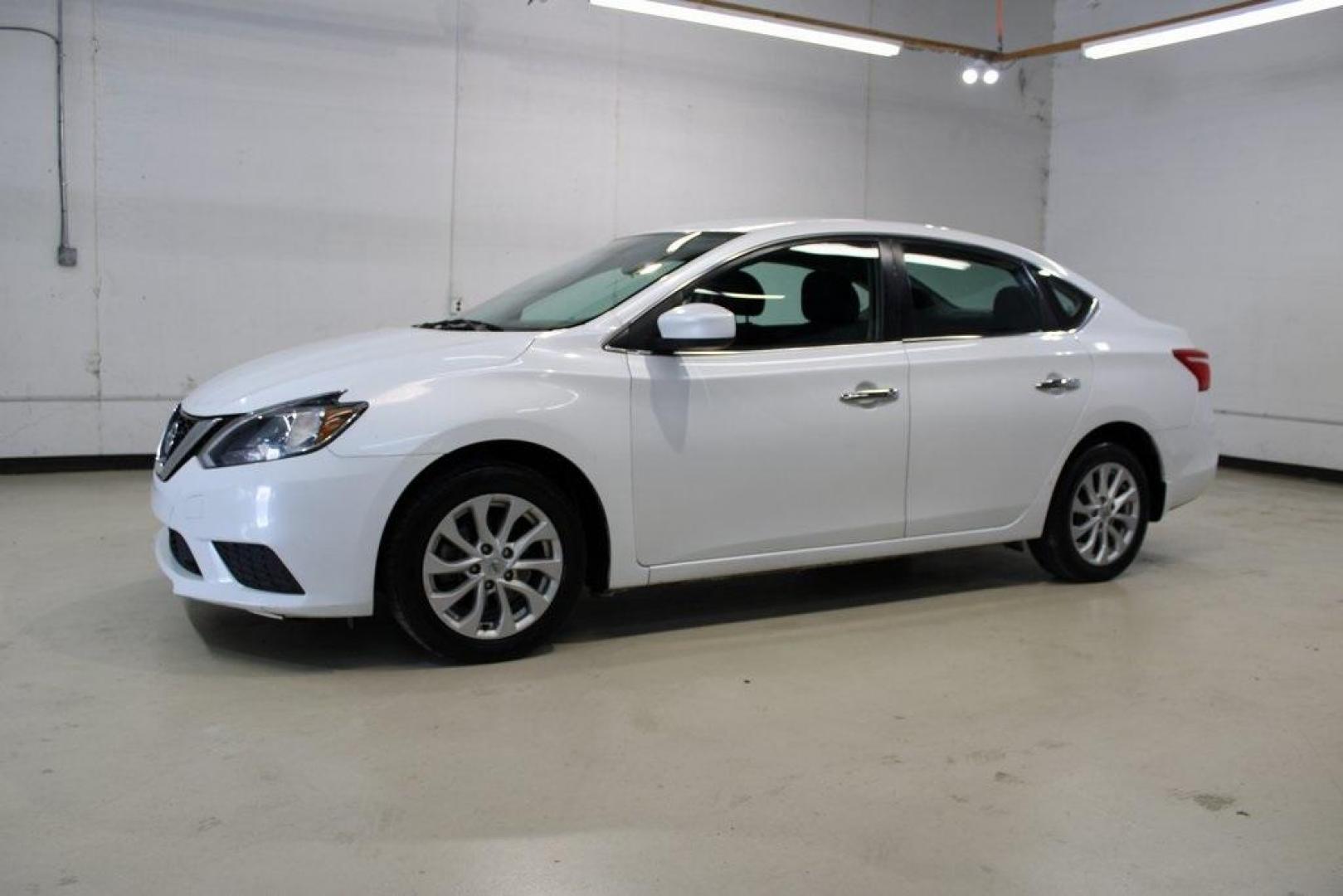 2019 Aspen White Tricoat /Charcoal Nissan Sentra SV (3N1AB7AP7KY) with an 1.8L 4-Cylinder DOHC 16V engine, CVT transmission, located at 15300 Midway Rd., Addison, TX, 75001, (972) 702-0011, 32.958321, -96.838074 - HOME OF THE NO HAGGLE PRICE - WHOLESALE PRICES TO THE PUBLIC!! Sentra SV, 4D Sedan, 1.8L 4-Cylinder DOHC 16V, CVT with Xtronic, FWD, Aspen White Tricoat, Charcoal Cloth.<br><br>Aspen White Tricoat 2019 Nissan Sentra SV<br><br>Recent Arrival! 29/37 City/Highway MPG<br><br><br>At Midway Auto Group, we - Photo#4