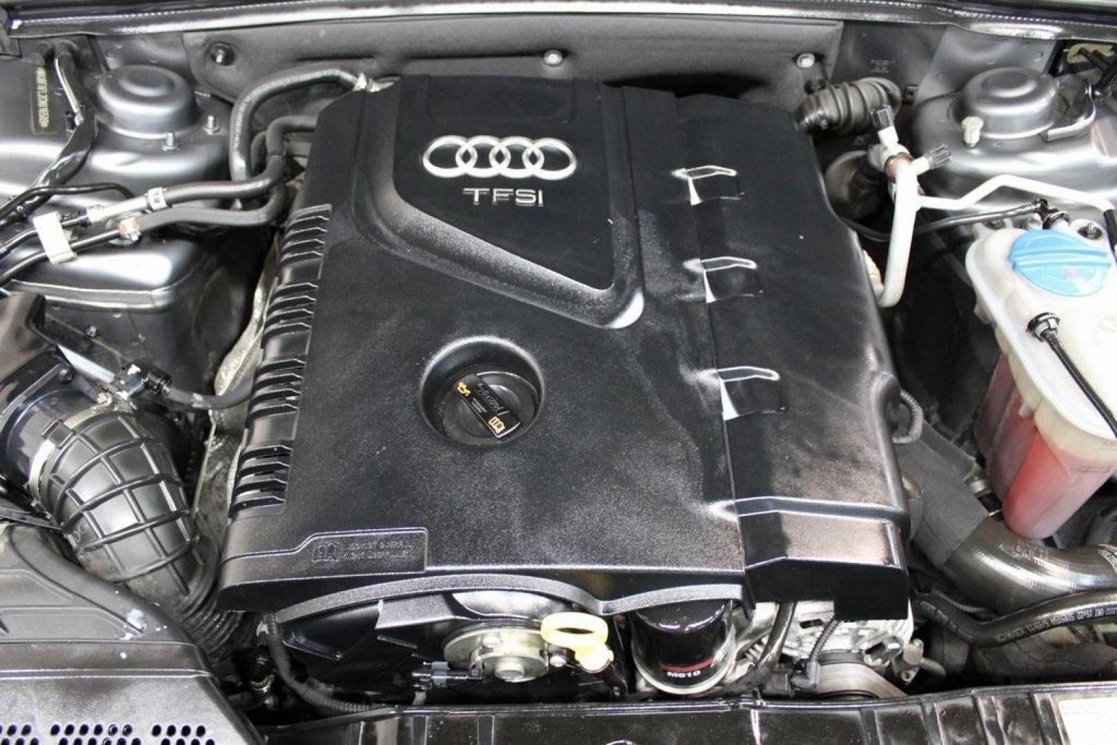 2012 Monsoon Gray Metallic /Black Audi A4 2.0T Premium (WAUBFAFL2CN) with an 2.0L 4-Cylinder TFSI DOHC engine, Automatic transmission, located at 15300 Midway Rd., Addison, TX, 75001, (972) 702-0011, 32.958321, -96.838074 - HOME OF THE NO HAGGLE PRICE - WHOLESALE PRICES TO THE PUBLIC!! A4 2.0T Premium quattro, 4D Sedan, 2.0L 4-Cylinder TFSI DOHC, 8-Speed Automatic with Tiptronic, quattro, Gray, Black Leather.<br><br>Gray 2012 Audi A4 2.0T Premium<br><br>Recent Arrival! 21/29 City/Highway MPG<br><br>Awards:<br> * 2012 - Photo#28