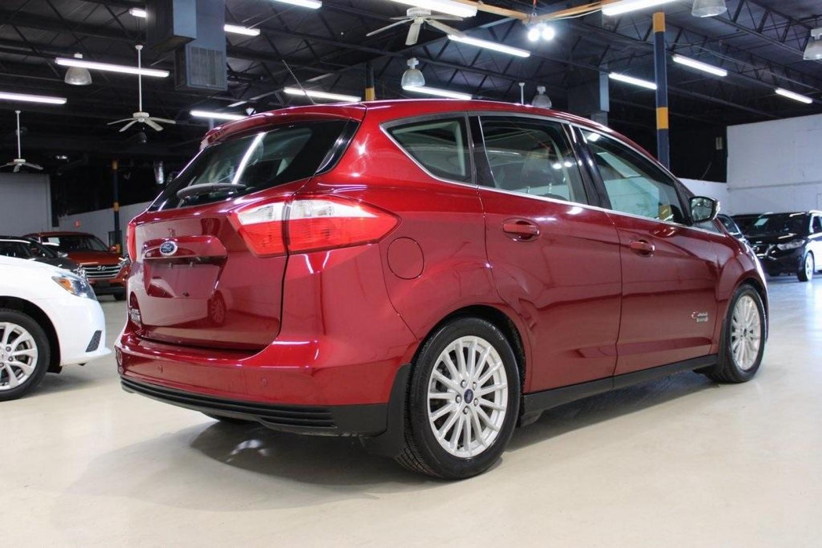 2014 Ruby Red Metallic Tinted Clearcoat /Charcoal Black Ford C-Max Energi SEL (1FADP5CU2EL) with an 2.0L I4 Atkinson-Cycle Hybrid engine, CVT transmission, located at 15300 Midway Rd., Addison, TX, 75001, (972) 702-0011, 32.958321, -96.838074 - HOME OF THE NO HAGGLE PRICE - WHOLESALE PRICES TO THE PUBLIC!! C-Max Energi SEL, 4D Hatchback, 2.0L I4 Atkinson-Cycle Hybrid, CVT, FWD, Red, Charcoal Black Leather.<br><br>Red 2014 Ford C-Max Energi SEL<br><br>Recent Arrival! 40/36 City/Highway MPG<br><br>Awards:<br> * 2014 KBB.com Brand Image Awar - Photo#1