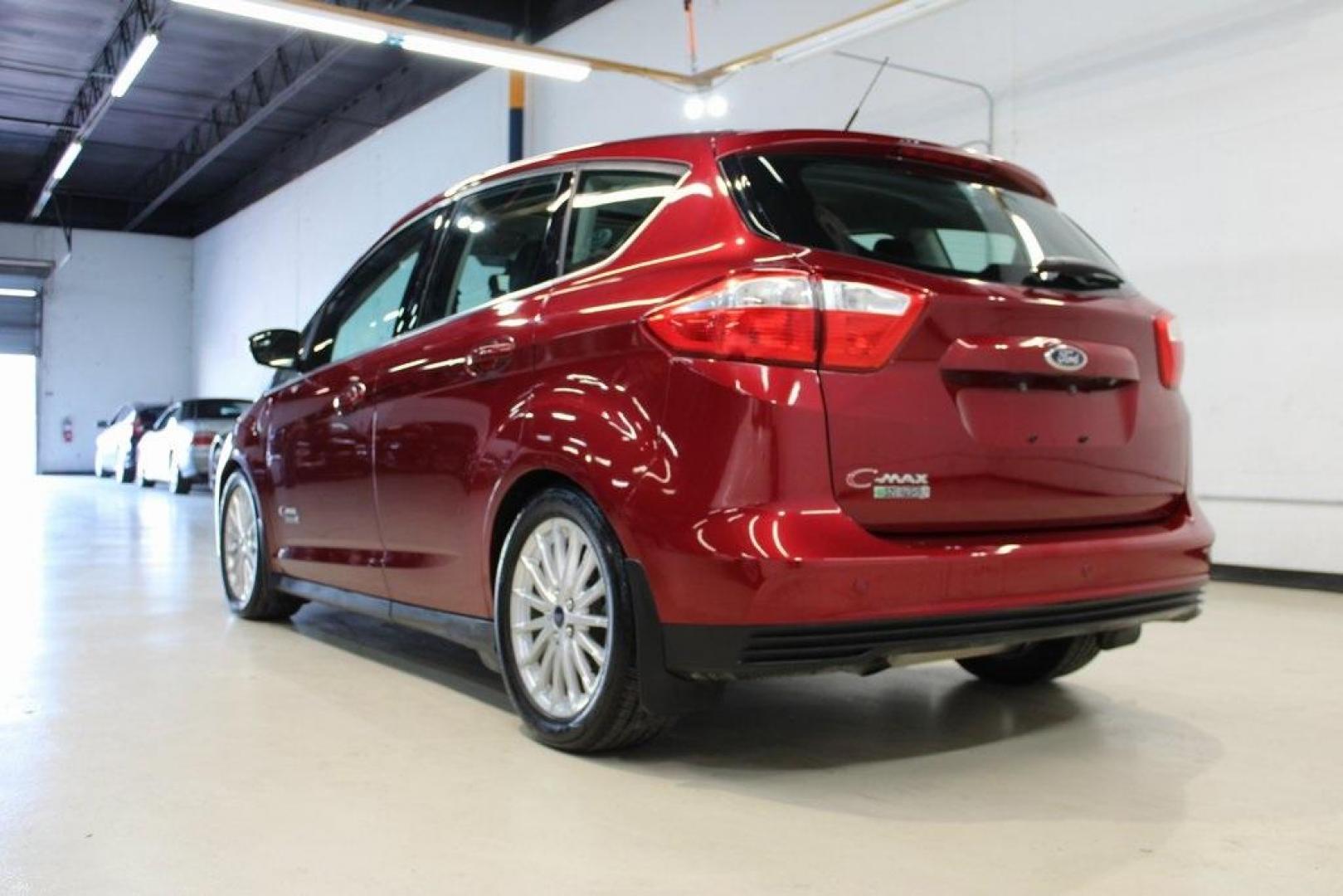 2014 Ruby Red Metallic Tinted Clearcoat /Charcoal Black Ford C-Max Energi SEL (1FADP5CU2EL) with an 2.0L I4 Atkinson-Cycle Hybrid engine, CVT transmission, located at 15300 Midway Rd., Addison, TX, 75001, (972) 702-0011, 32.958321, -96.838074 - HOME OF THE NO HAGGLE PRICE - WHOLESALE PRICES TO THE PUBLIC!! C-Max Energi SEL, 4D Hatchback, 2.0L I4 Atkinson-Cycle Hybrid, CVT, FWD, Red, Charcoal Black Leather.<br><br>Red 2014 Ford C-Max Energi SEL<br><br>Recent Arrival! 40/36 City/Highway MPG<br><br>Awards:<br> * 2014 KBB.com Brand Image Awar - Photo#2