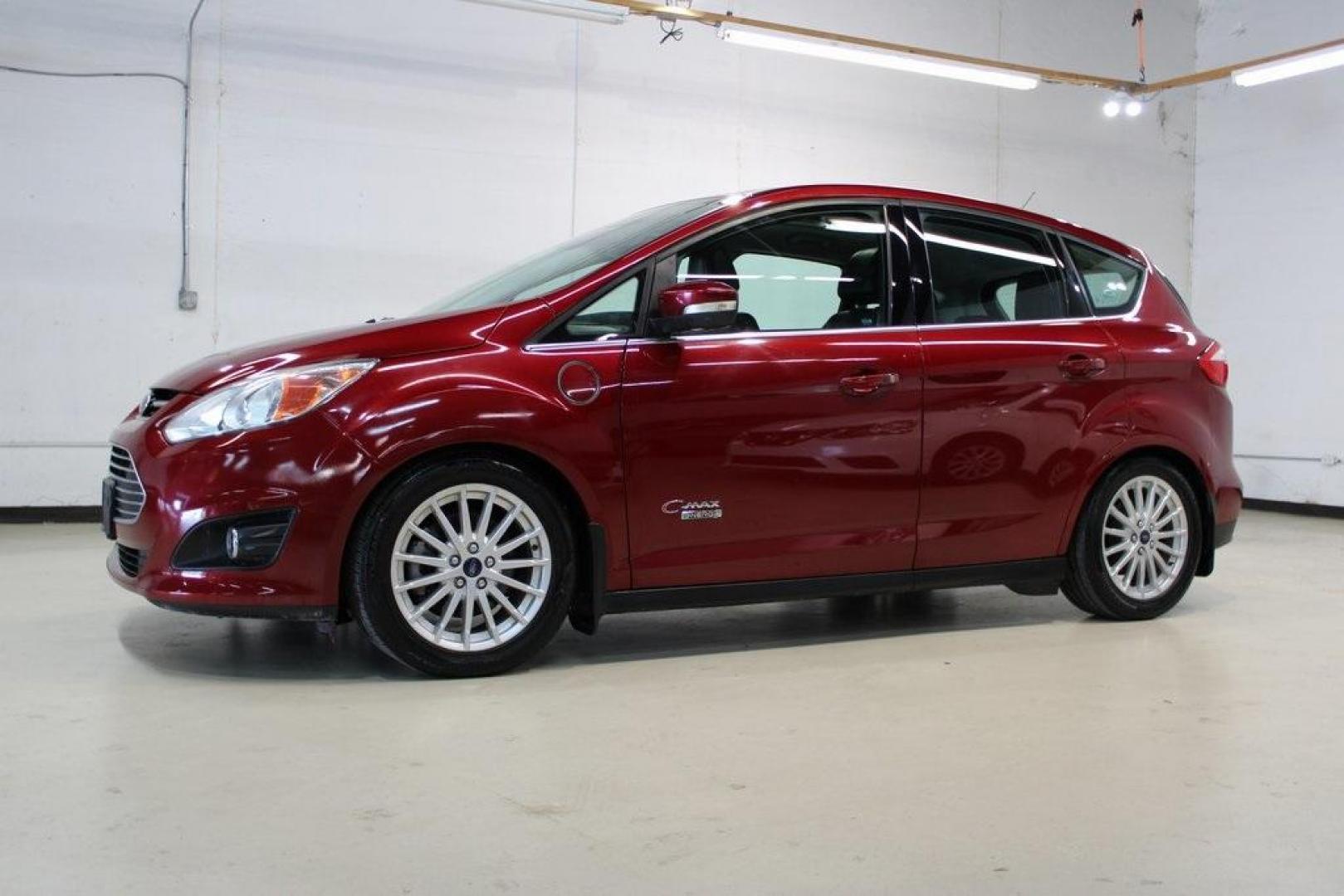 2014 Ruby Red Metallic Tinted Clearcoat /Charcoal Black Ford C-Max Energi SEL (1FADP5CU2EL) with an 2.0L I4 Atkinson-Cycle Hybrid engine, CVT transmission, located at 15300 Midway Rd., Addison, TX, 75001, (972) 702-0011, 32.958321, -96.838074 - HOME OF THE NO HAGGLE PRICE - WHOLESALE PRICES TO THE PUBLIC!! C-Max Energi SEL, 4D Hatchback, 2.0L I4 Atkinson-Cycle Hybrid, CVT, FWD, Red, Charcoal Black Leather.<br><br>Red 2014 Ford C-Max Energi SEL<br><br>Recent Arrival! 40/36 City/Highway MPG<br><br>Awards:<br> * 2014 KBB.com Brand Image Awar - Photo#3