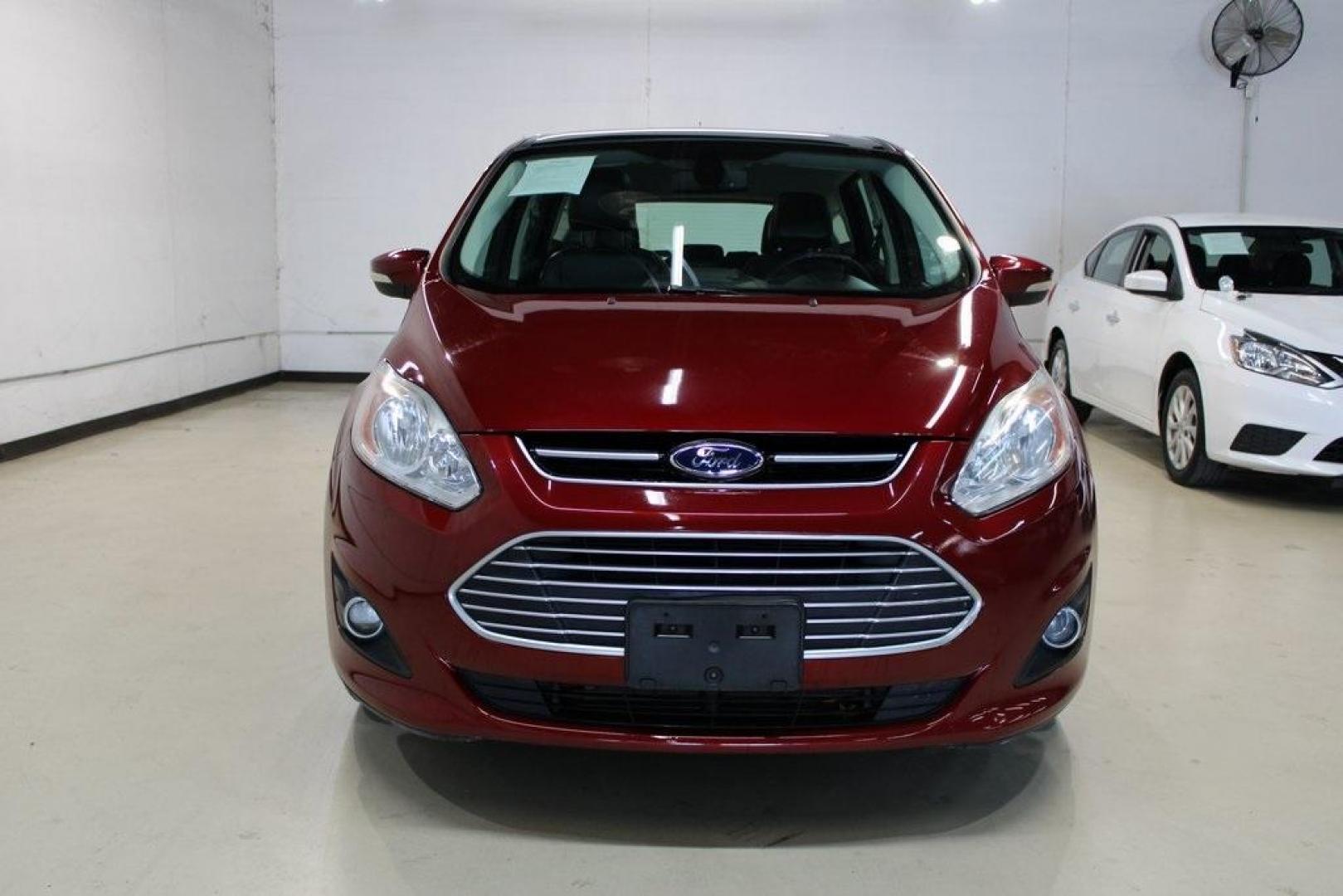 2014 Ruby Red Metallic Tinted Clearcoat /Charcoal Black Ford C-Max Energi SEL (1FADP5CU2EL) with an 2.0L I4 Atkinson-Cycle Hybrid engine, CVT transmission, located at 15300 Midway Rd., Addison, TX, 75001, (972) 702-0011, 32.958321, -96.838074 - HOME OF THE NO HAGGLE PRICE - WHOLESALE PRICES TO THE PUBLIC!! C-Max Energi SEL, 4D Hatchback, 2.0L I4 Atkinson-Cycle Hybrid, CVT, FWD, Red, Charcoal Black Leather.<br><br>Red 2014 Ford C-Max Energi SEL<br><br>Recent Arrival! 40/36 City/Highway MPG<br><br>Awards:<br> * 2014 KBB.com Brand Image Awar - Photo#4