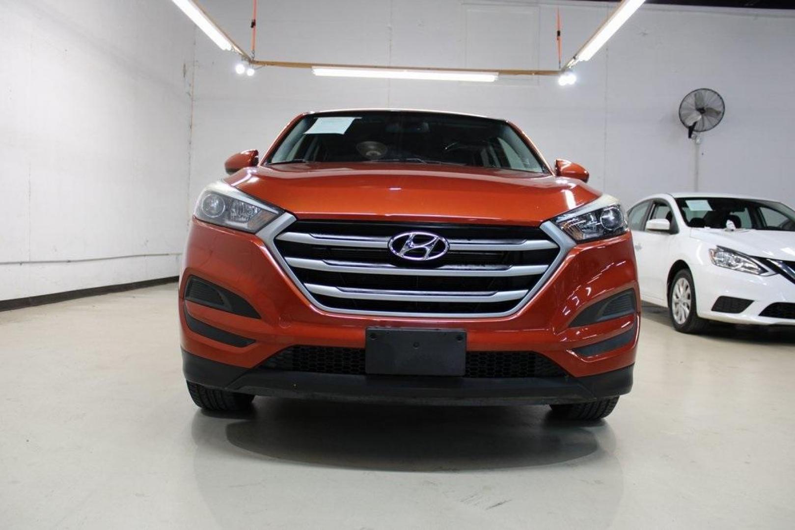 2017 Sedona Sunset /Black Hyundai Tucson SE (KM8J23A44HU) with an 2.0L DOHC engine, Automatic transmission, located at 15300 Midway Rd., Addison, TX, 75001, (972) 702-0011, 32.958321, -96.838074 - HOME OF THE NO HAGGLE PRICE - WHOLESALE PRICES TO THE PUBLIC!! Tucson SE, 4D Sport Utility, 2.0L DOHC, 6-Speed Automatic with Shiftronic, FWD, Sedona Sunset, Black Cloth.<br><br>Sedona Sunset 2017 Hyundai Tucson SE<br><br>23/30 City/Highway MPG<br><br>Awards:<br> * 2017 KBB.com 10 Best SUVs Under $ - Photo#5