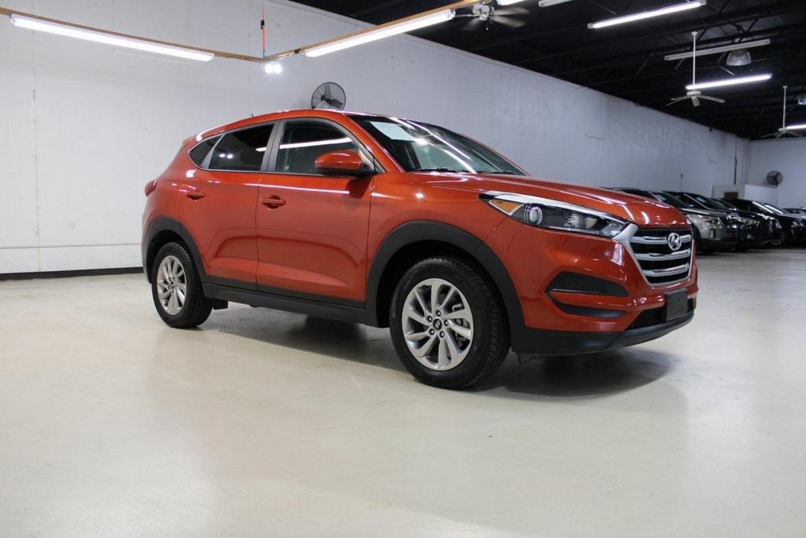 2017 Sedona Sunset /Black Hyundai Tucson SE (KM8J23A44HU) with an 2.0L DOHC engine, Automatic transmission, located at 15300 Midway Rd., Addison, TX, 75001, (972) 702-0011, 32.958321, -96.838074 - HOME OF THE NO HAGGLE PRICE - WHOLESALE PRICES TO THE PUBLIC!! Tucson SE, 4D Sport Utility, 2.0L DOHC, 6-Speed Automatic with Shiftronic, FWD, Sedona Sunset, Black Cloth.<br><br>Sedona Sunset 2017 Hyundai Tucson SE<br><br>23/30 City/Highway MPG<br><br>Awards:<br> * 2017 KBB.com 10 Best SUVs Under $ - Photo#6