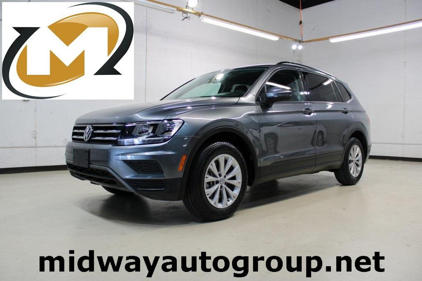 2019 Platinum Gray Metallic /Storm Gray Volkswagen Tiguan 2.0T S (3VV1B7AX2KM) with an 2.0L TSI DOHC engine, Automatic transmission, located at 15300 Midway Rd., Addison, TX, 75001, (972) 702-0011, 32.958321, -96.838074 - HOME OF THE NO HAGGLE PRICE - WHOLESALE PRICES TO THE PUBLIC!! non smoker, Tiguan 2.0T S, 4D Sport Utility, 2.0L TSI DOHC, 8-Speed Automatic with Tiptronic, FWD, Gray, Storm Gray Cloth.<br><br>Gray 2019 Volkswagen Tiguan 2.0T S<br><br>Recent Arrival! 22/29 City/Highway MPG<br><br><br>At Midway Auto - Photo#0