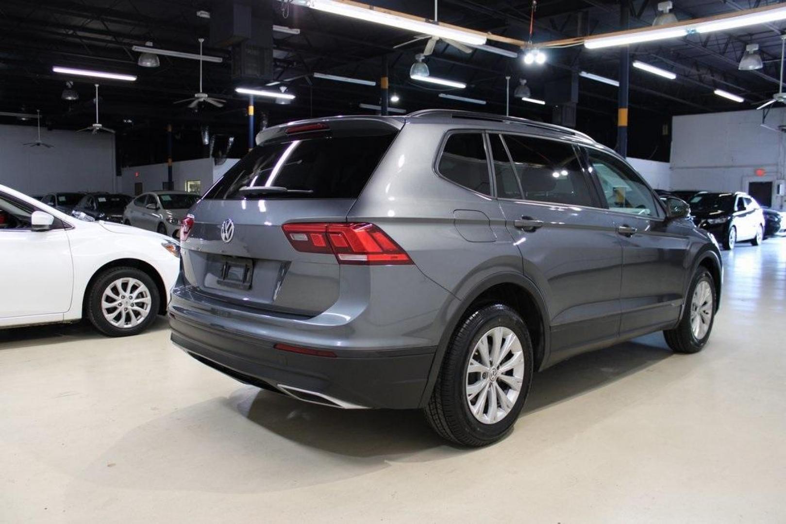 2019 Platinum Gray Metallic /Storm Gray Volkswagen Tiguan 2.0T S (3VV1B7AX2KM) with an 2.0L TSI DOHC engine, Automatic transmission, located at 15300 Midway Rd., Addison, TX, 75001, (972) 702-0011, 32.958321, -96.838074 - HOME OF THE NO HAGGLE PRICE - WHOLESALE PRICES TO THE PUBLIC!! non smoker, Tiguan 2.0T S, 4D Sport Utility, 2.0L TSI DOHC, 8-Speed Automatic with Tiptronic, FWD, Gray, Storm Gray Cloth.<br><br>Gray 2019 Volkswagen Tiguan 2.0T S<br><br>Recent Arrival! 22/29 City/Highway MPG<br><br><br>At Midway Auto - Photo#1