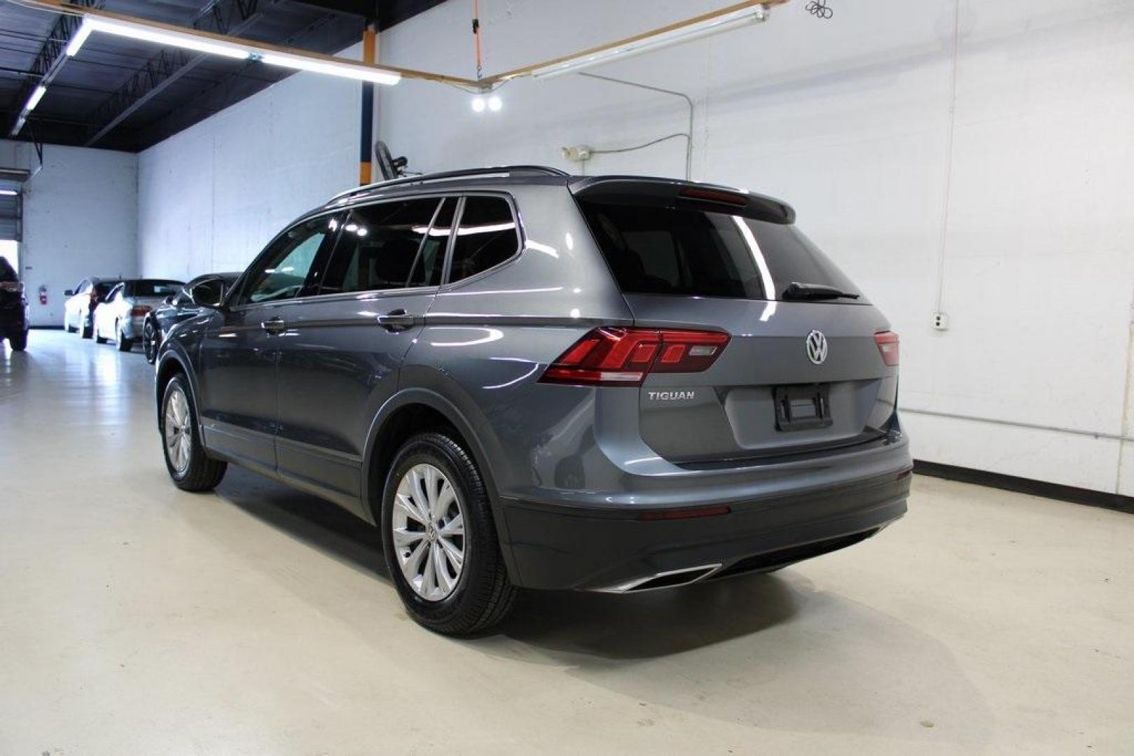 2019 Platinum Gray Metallic /Storm Gray Volkswagen Tiguan 2.0T S (3VV1B7AX2KM) with an 2.0L TSI DOHC engine, Automatic transmission, located at 15300 Midway Rd., Addison, TX, 75001, (972) 702-0011, 32.958321, -96.838074 - HOME OF THE NO HAGGLE PRICE - WHOLESALE PRICES TO THE PUBLIC!! non smoker, Tiguan 2.0T S, 4D Sport Utility, 2.0L TSI DOHC, 8-Speed Automatic with Tiptronic, FWD, Gray, Storm Gray Cloth.<br><br>Gray 2019 Volkswagen Tiguan 2.0T S<br><br>Recent Arrival! 22/29 City/Highway MPG<br><br><br>At Midway Auto - Photo#2