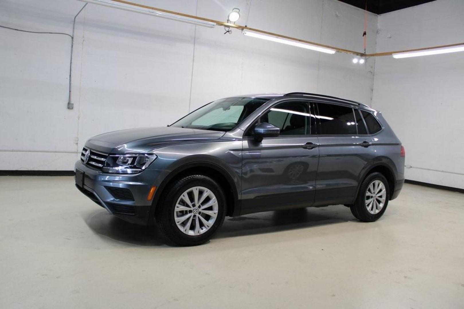 2019 Platinum Gray Metallic /Storm Gray Volkswagen Tiguan 2.0T S (3VV1B7AX2KM) with an 2.0L TSI DOHC engine, Automatic transmission, located at 15300 Midway Rd., Addison, TX, 75001, (972) 702-0011, 32.958321, -96.838074 - HOME OF THE NO HAGGLE PRICE - WHOLESALE PRICES TO THE PUBLIC!! non smoker, Tiguan 2.0T S, 4D Sport Utility, 2.0L TSI DOHC, 8-Speed Automatic with Tiptronic, FWD, Gray, Storm Gray Cloth.<br><br>Gray 2019 Volkswagen Tiguan 2.0T S<br><br>Recent Arrival! 22/29 City/Highway MPG<br><br><br>At Midway Auto - Photo#3