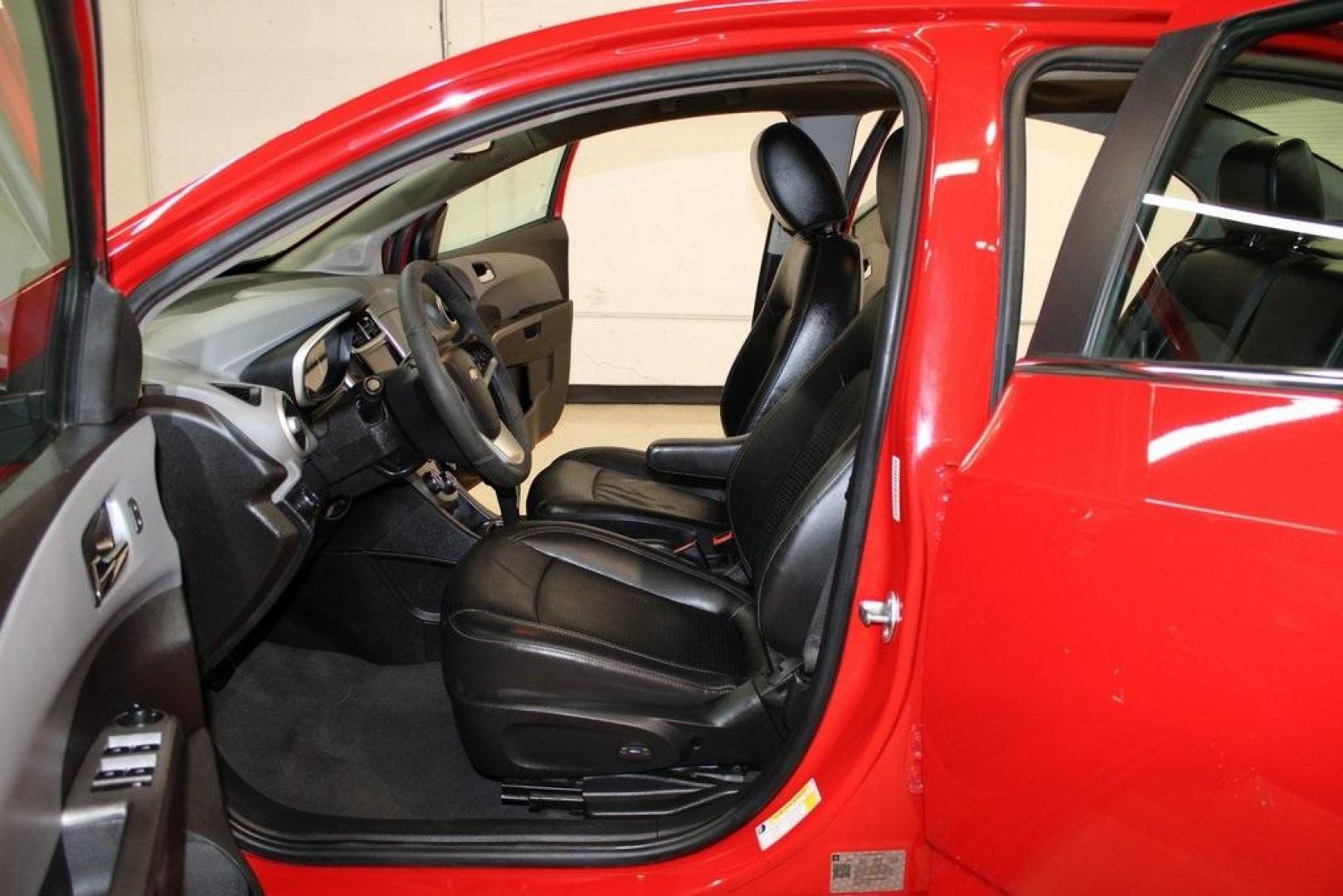 2020 Red Hot /Jet Black/Dark Titanium Chevrolet Sonic Premier (1G1JF5SB3L4) with an I4 engine, Automatic transmission, located at 15300 Midway Rd., Addison, TX, 75001, (972) 702-0011, 32.958321, -96.838074 - HOME OF THE NO HAGGLE PRICE - WHOLESALE PRICES TO THE PUBLIC!! Sonic Premier, 4D Sedan, I4, 6-Speed Automatic, FWD, Red Hot, Jet Black/Dark Titanium Artificial Leather.<br><br>Red Hot 2020 Chevrolet Sonic Premier<br><br>26/34 City/Highway MPG<br><br>Awards:<br> * JD Power Initial Quality Study<br>< - Photo#12