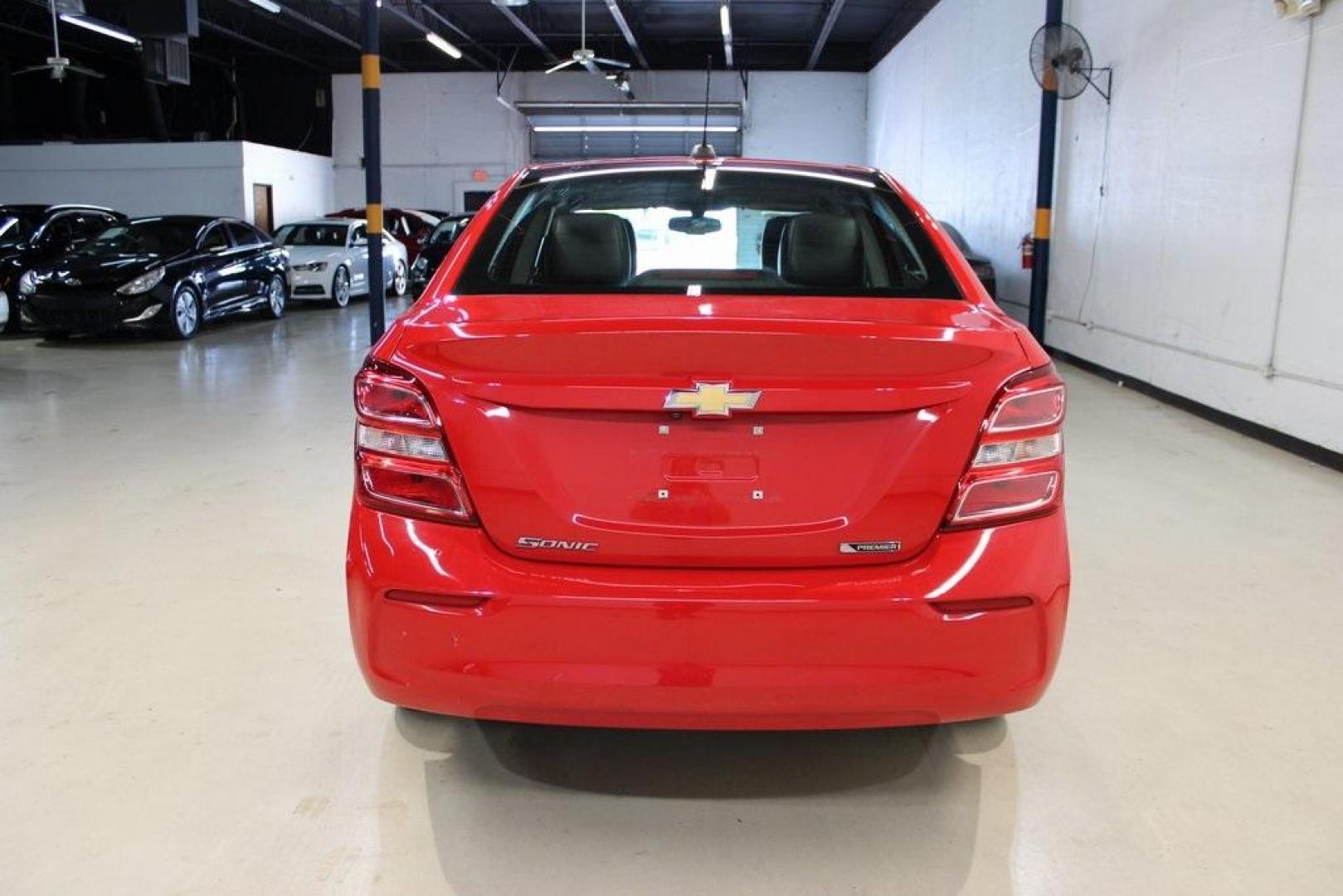 2020 Red Hot /Jet Black/Dark Titanium Chevrolet Sonic Premier (1G1JF5SB3L4) with an I4 engine, Automatic transmission, located at 15300 Midway Rd., Addison, TX, 75001, (972) 702-0011, 32.958321, -96.838074 - HOME OF THE NO HAGGLE PRICE - WHOLESALE PRICES TO THE PUBLIC!! Sonic Premier, 4D Sedan, I4, 6-Speed Automatic, FWD, Red Hot, Jet Black/Dark Titanium Artificial Leather.<br><br>Red Hot 2020 Chevrolet Sonic Premier<br><br>26/34 City/Highway MPG<br><br>Awards:<br> * JD Power Initial Quality Study<br>< - Photo#7