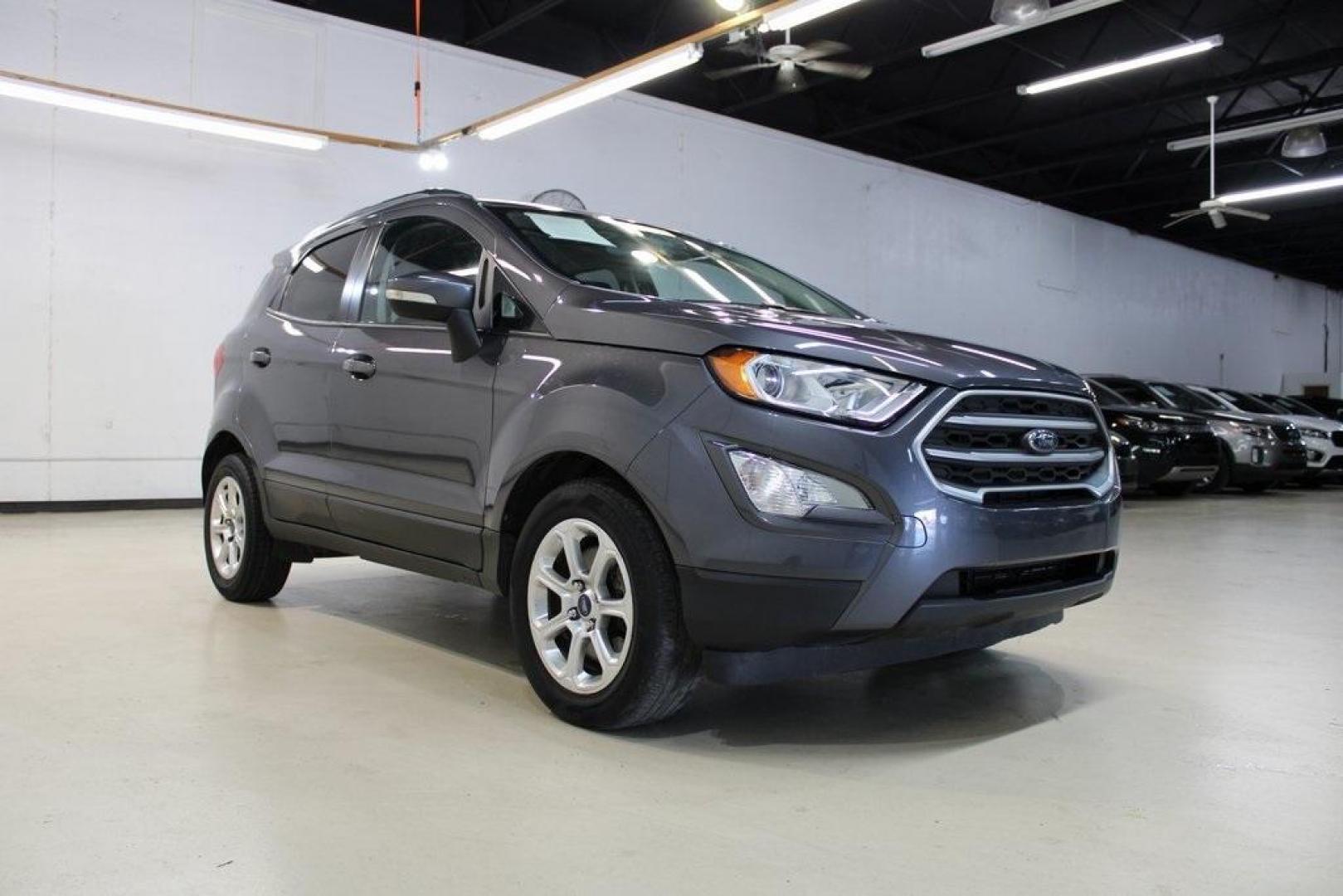 2018 Smoke /Ebony Black Ford EcoSport SE (MAJ3P1TEXJC) with an EcoBoost 1.0L I3 GTDi DOHC Turbocharged VCT engine, Automatic transmission, located at 15300 Midway Rd., Addison, TX, 75001, (972) 702-0011, 32.958321, -96.838074 - HOME OF THE NO HAGGLE PRICE - WHOLESALE PRICES TO THE PUBLIC!! EcoSport SE, 4D Sport Utility, EcoBoost 1.0L I3 GTDi DOHC Turbocharged VCT, 6-Speed Automatic, FWD, Smoke, Ebony Black Cloth.<br><br>Smoke 2018 Ford EcoSport SE<br><br>Recent Arrival! 27/29 City/Highway MPG<br><br>Awards:<br> * 2018 KBB - Photo#1