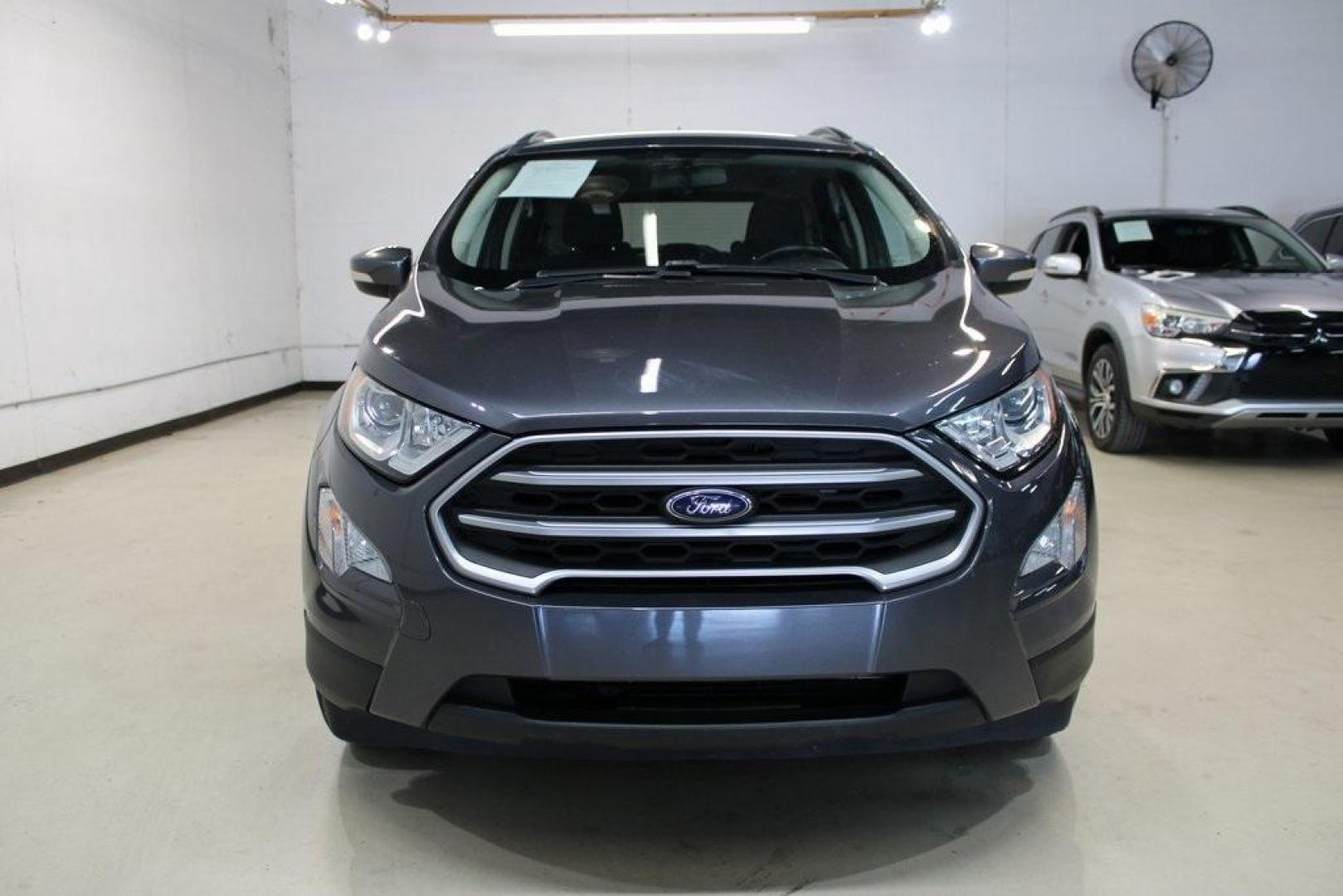 2018 Smoke /Ebony Black Ford EcoSport SE (MAJ3P1TEXJC) with an EcoBoost 1.0L I3 GTDi DOHC Turbocharged VCT engine, Automatic transmission, located at 15300 Midway Rd., Addison, TX, 75001, (972) 702-0011, 32.958321, -96.838074 - HOME OF THE NO HAGGLE PRICE - WHOLESALE PRICES TO THE PUBLIC!! EcoSport SE, 4D Sport Utility, EcoBoost 1.0L I3 GTDi DOHC Turbocharged VCT, 6-Speed Automatic, FWD, Smoke, Ebony Black Cloth.<br><br>Smoke 2018 Ford EcoSport SE<br><br>Recent Arrival! 27/29 City/Highway MPG<br><br>Awards:<br> * 2018 KBB - Photo#7