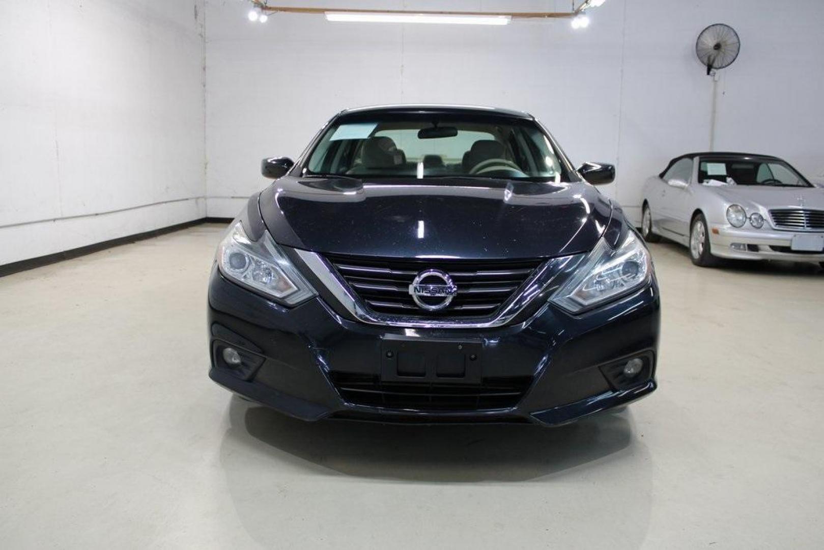 2016 Storm Blue /Beige Nissan Altima 2.5 SV (1N4AL3AP3GC) with an 2.5L 4-Cylinder DOHC 16V engine, CVT transmission, located at 15300 Midway Rd., Addison, TX, 75001, (972) 702-0011, 32.958321, -96.838074 - HOME OF THE NO HAGGLE PRICE - WHOLESALE PRICES TO THE PUBLIC!! Altima 2.5 SV, 4D Sedan, 2.5L 4-Cylinder DOHC 16V, CVT with Xtronic, FWD, Storm Blue, Beige Cloth.<br><br>Storm Blue 2016 Nissan Altima 2.5 SV<br><br>27/39 City/Highway MPG<br><br>Awards:<br> * 2016 KBB.com 10 Best Sedans Under $25,000< - Photo#5