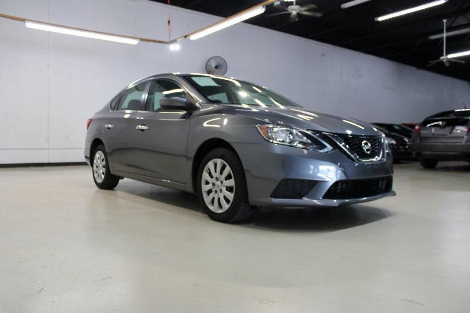 2019 Gun Metallic /Charcoal Nissan Sentra S (3N1AB7AP1KY) with an 1.8L 4-Cylinder DOHC 16V engine, CVT transmission, located at 15300 Midway Rd., Addison, TX, 75001, (972) 702-0011, 32.958321, -96.838074 - HOME OF THE NO HAGGLE PRICE - WHOLESALE PRICES TO THE PUBLIC!! Sentra S, 4D Sedan, 1.8L 4-Cylinder DOHC 16V, CVT with Xtronic, FWD, Gun Metallic, Charcoal Cloth.<br><br>Gun Metallic 2019 Nissan Sentra S<br><br>29/37 City/Highway MPG<br><br><br>At Midway Auto Group, we strive to provide you with the - Photo#1