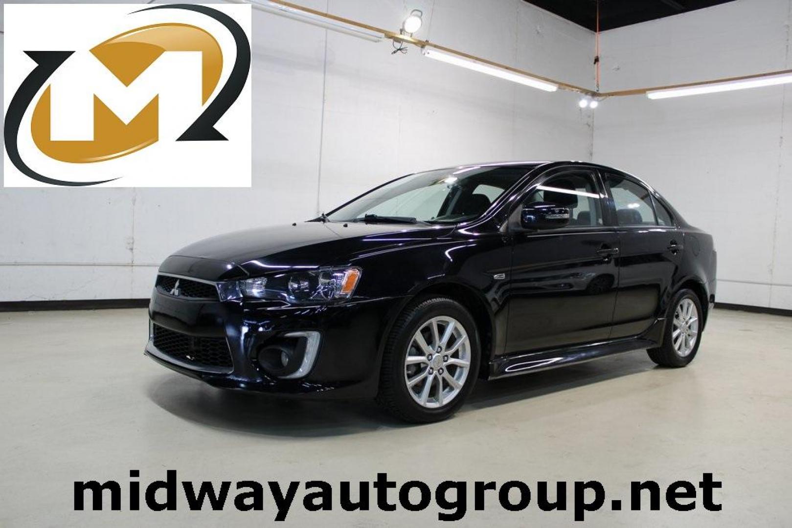 2016 Labrador Black Pearl /Black Mitsubishi Lancer ES (JA32U2FU3GU) with an 2.0L I4 MIVEC DOHC I4 engine, CVT transmission, located at 15300 Midway Rd., Addison, TX, 75001, (972) 702-0011, 32.958321, -96.838074 - HOME OF THE NO HAGGLE PRICE - WHOLESALE PRICES TO THE PUBLIC!! Lancer ES, 4D Sedan, 2.0L I4 MIVEC DOHC I4, FWD, Black, Black Cloth. Priced below KBB Fair Purchase Price! Odometer is 54791 miles below market average!<br><br>Black 2016 Mitsubishi Lancer ES<br><br>Recent Arrival!<br><br><br>At Midway A - Photo#0