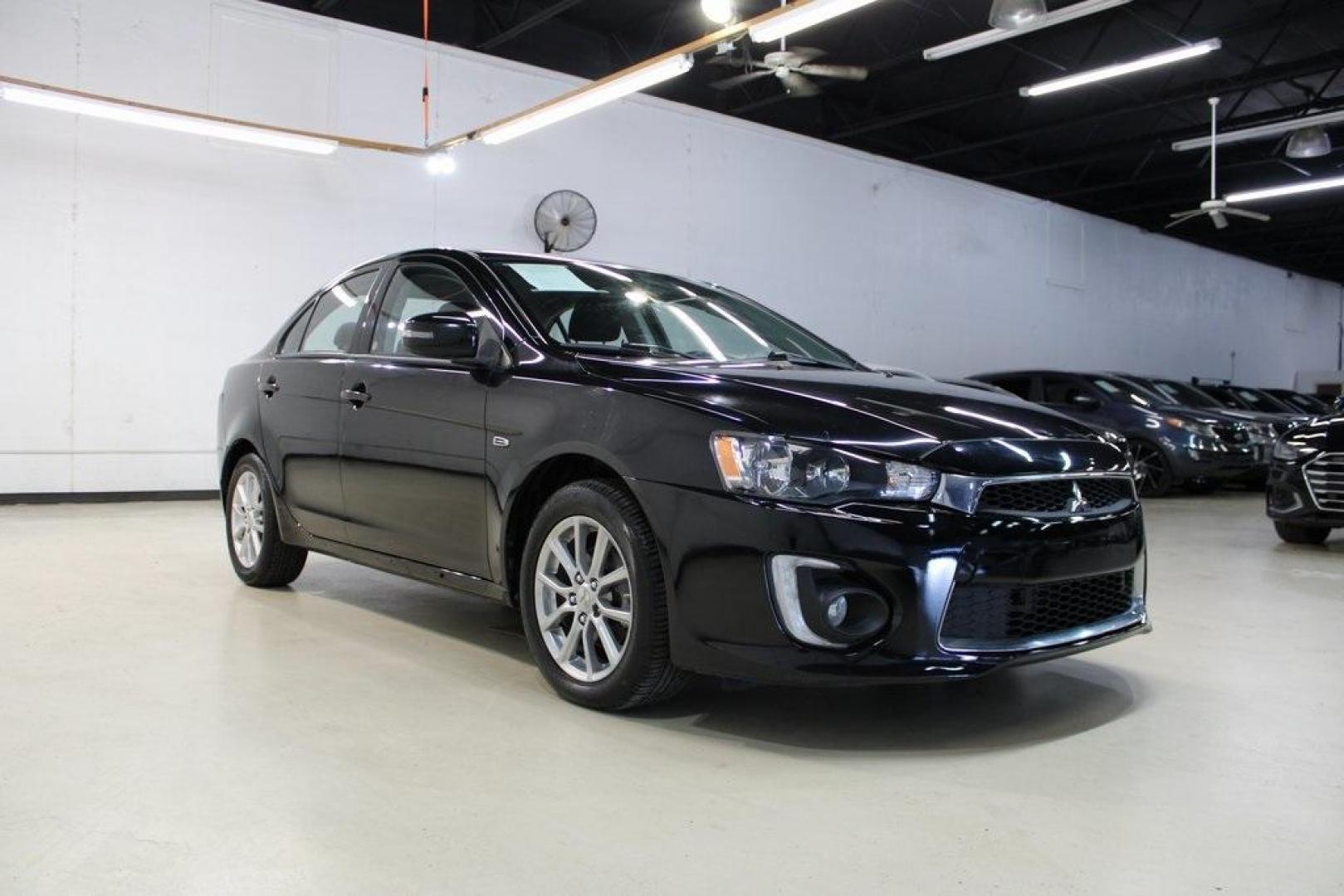 2016 Labrador Black Pearl /Black Mitsubishi Lancer ES (JA32U2FU3GU) with an 2.0L I4 MIVEC DOHC I4 engine, CVT transmission, located at 15300 Midway Rd., Addison, TX, 75001, (972) 702-0011, 32.958321, -96.838074 - HOME OF THE NO HAGGLE PRICE - WHOLESALE PRICES TO THE PUBLIC!! Lancer ES, 4D Sedan, 2.0L I4 MIVEC DOHC I4, FWD, Black, Black Cloth. Priced below KBB Fair Purchase Price! Odometer is 54791 miles below market average!<br><br>Black 2016 Mitsubishi Lancer ES<br><br>Recent Arrival!<br><br><br>At Midway A - Photo#1