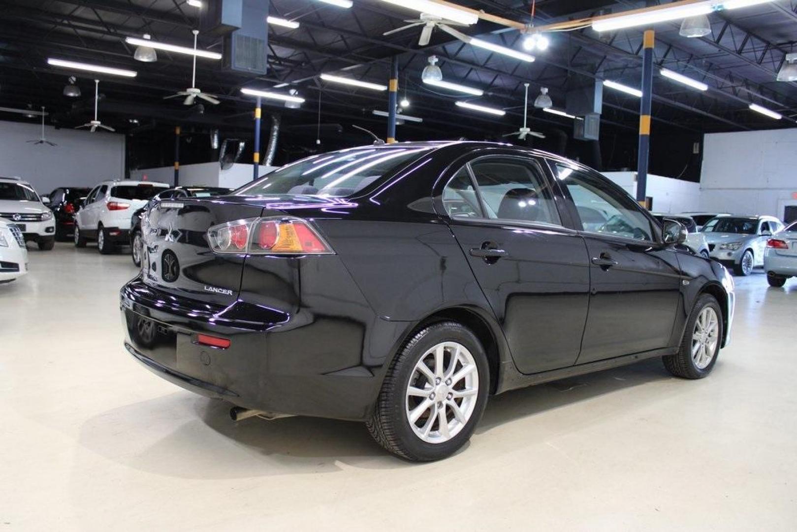 2016 Labrador Black Pearl /Black Mitsubishi Lancer ES (JA32U2FU3GU) with an 2.0L I4 MIVEC DOHC I4 engine, CVT transmission, located at 15300 Midway Rd., Addison, TX, 75001, (972) 702-0011, 32.958321, -96.838074 - HOME OF THE NO HAGGLE PRICE - WHOLESALE PRICES TO THE PUBLIC!! Lancer ES, 4D Sedan, 2.0L I4 MIVEC DOHC I4, FWD, Black, Black Cloth. Priced below KBB Fair Purchase Price! Odometer is 54791 miles below market average!<br><br>Black 2016 Mitsubishi Lancer ES<br><br>Recent Arrival!<br><br><br>At Midway A - Photo#2