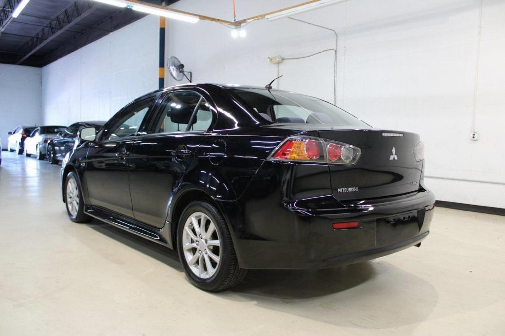 2016 Labrador Black Pearl /Black Mitsubishi Lancer ES (JA32U2FU3GU) with an 2.0L I4 MIVEC DOHC I4 engine, CVT transmission, located at 15300 Midway Rd., Addison, TX, 75001, (972) 702-0011, 32.958321, -96.838074 - HOME OF THE NO HAGGLE PRICE - WHOLESALE PRICES TO THE PUBLIC!! Lancer ES, 4D Sedan, 2.0L I4 MIVEC DOHC I4, FWD, Black, Black Cloth. Priced below KBB Fair Purchase Price! Odometer is 54791 miles below market average!<br><br>Black 2016 Mitsubishi Lancer ES<br><br>Recent Arrival!<br><br><br>At Midway A - Photo#3