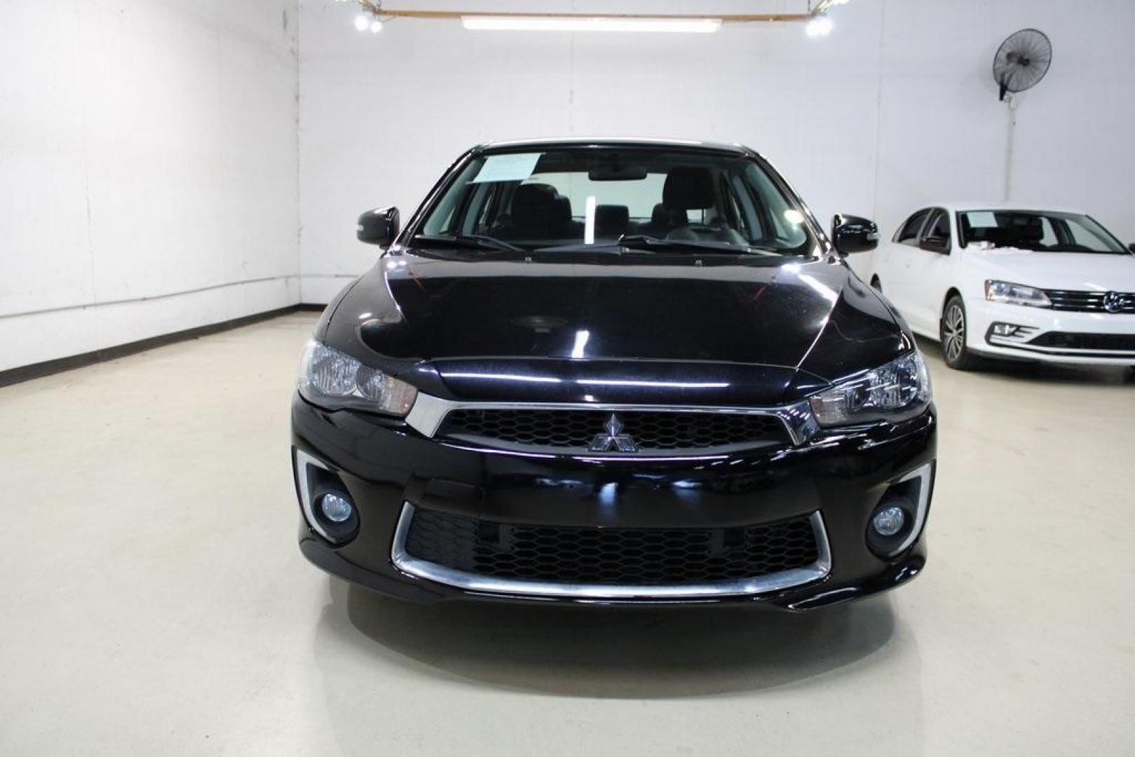 2016 Labrador Black Pearl /Black Mitsubishi Lancer ES (JA32U2FU3GU) with an 2.0L I4 MIVEC DOHC I4 engine, CVT transmission, located at 15300 Midway Rd., Addison, TX, 75001, (972) 702-0011, 32.958321, -96.838074 - HOME OF THE NO HAGGLE PRICE - WHOLESALE PRICES TO THE PUBLIC!! Lancer ES, 4D Sedan, 2.0L I4 MIVEC DOHC I4, FWD, Black, Black Cloth. Priced below KBB Fair Purchase Price! Odometer is 54791 miles below market average!<br><br>Black 2016 Mitsubishi Lancer ES<br><br>Recent Arrival!<br><br><br>At Midway A - Photo#5