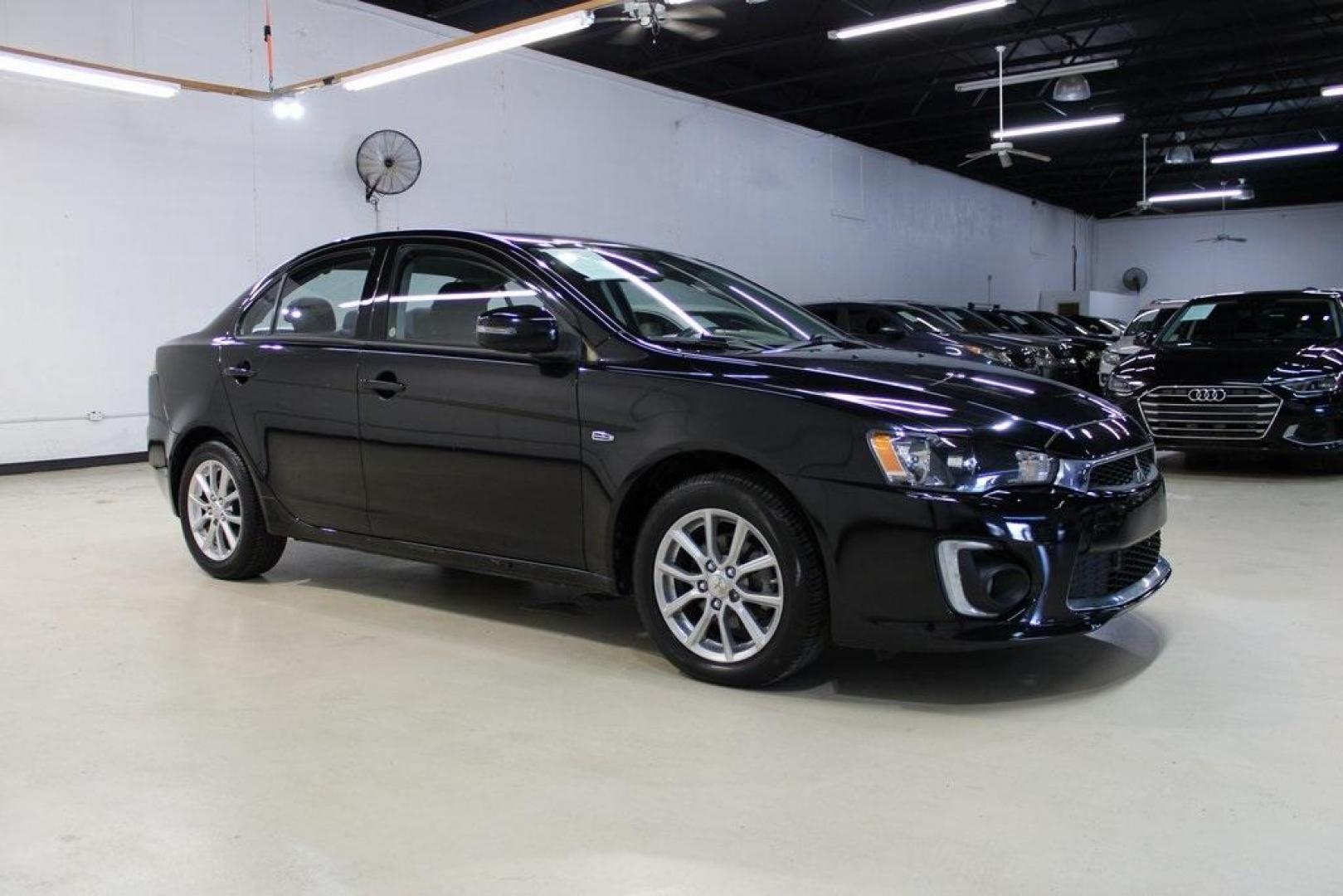 2016 Labrador Black Pearl /Black Mitsubishi Lancer ES (JA32U2FU3GU) with an 2.0L I4 MIVEC DOHC I4 engine, CVT transmission, located at 15300 Midway Rd., Addison, TX, 75001, (972) 702-0011, 32.958321, -96.838074 - HOME OF THE NO HAGGLE PRICE - WHOLESALE PRICES TO THE PUBLIC!! Lancer ES, 4D Sedan, 2.0L I4 MIVEC DOHC I4, FWD, Black, Black Cloth. Priced below KBB Fair Purchase Price! Odometer is 54791 miles below market average!<br><br>Black 2016 Mitsubishi Lancer ES<br><br>Recent Arrival!<br><br><br>At Midway A - Photo#6