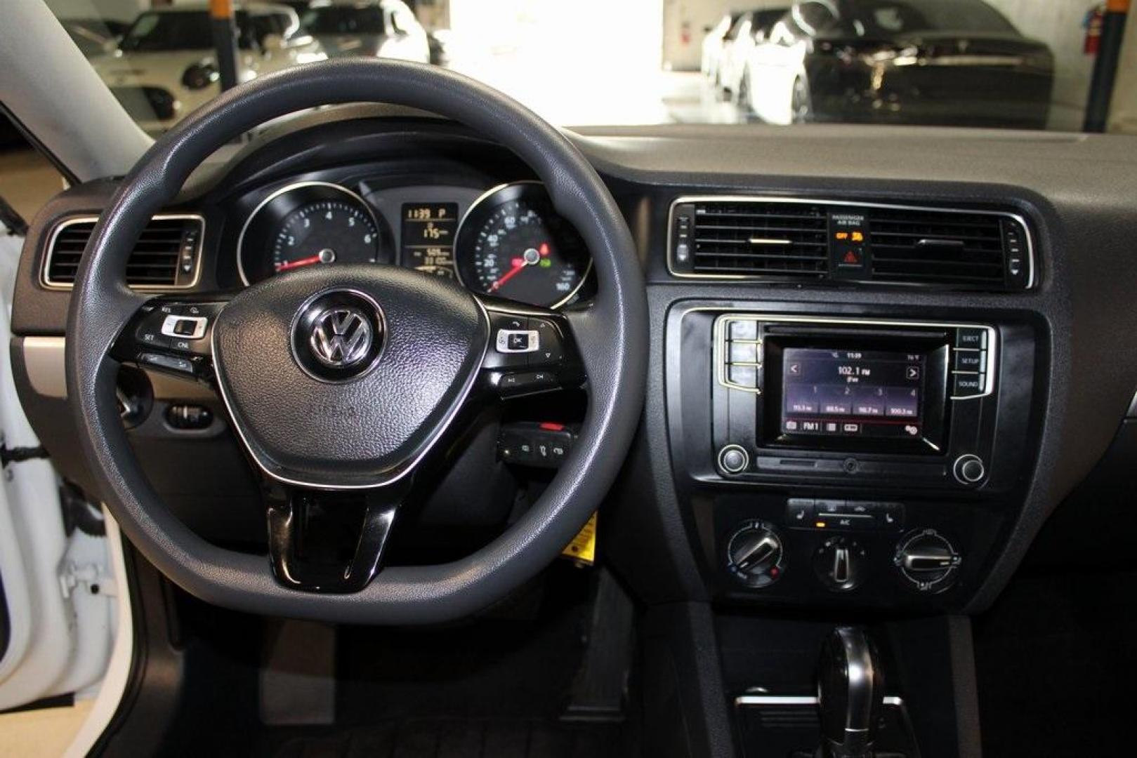 2018 White /Titan Black Volkswagen Jetta 1.4T SE (3VWDB7AJ5JM) with an 1.4L TSI engine, Automatic transmission, located at 15300 Midway Rd., Addison, TX, 75001, (972) 702-0011, 32.958321, -96.838074 - HOME OF THE NO HAGGLE PRICE - WHOLESALE PRICES TO THE PUBLIC!! Jetta 1.4T SE, 4D Sedan, 1.4L TSI, 6-Speed Automatic with Tiptronic, FWD, White.<br><br>White 2018 Volkswagen Jetta 1.4T SE<br><br>28/38 City/Highway MPG<br><br><br>At Midway Auto Group, we strive to provide you with the best quality veh - Photo#16