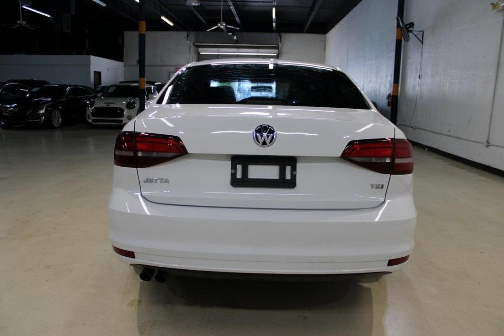 2018 White /Titan Black Volkswagen Jetta 1.4T SE (3VWDB7AJ5JM) with an 1.4L TSI engine, Automatic transmission, located at 15300 Midway Rd., Addison, TX, 75001, (972) 702-0011, 32.958321, -96.838074 - HOME OF THE NO HAGGLE PRICE - WHOLESALE PRICES TO THE PUBLIC!! Jetta 1.4T SE, 4D Sedan, 1.4L TSI, 6-Speed Automatic with Tiptronic, FWD, White.<br><br>White 2018 Volkswagen Jetta 1.4T SE<br><br>28/38 City/Highway MPG<br><br><br>At Midway Auto Group, we strive to provide you with the best quality veh - Photo#7