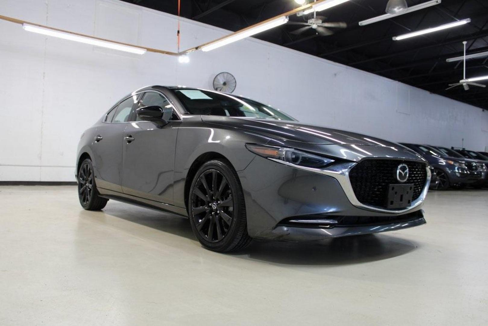 2021 Machine Gray Metallic /Black Mazda Mazda3 Premium Plus (JM1BPBEY9M1) with an I4 engine, Automatic transmission, located at 15300 Midway Rd., Addison, TX, 75001, (972) 702-0011, 32.958321, -96.838074 - HOME OF THE NO HAGGLE PRICE - WHOLESALE PRICES TO THE PUBLIC!! Mazda3 Premium Plus, 4D Sedan, I4, 6-Speed Automatic, AWD, Machine Gray Metallic, Black Leather.<br><br>Machine Gray Metallic 2021 Mazda Mazda3 Premium Plus<br><br>Recent Arrival! 23/32 City/Highway MPG<br><br><br>At Midway Auto Group, w - Photo#1