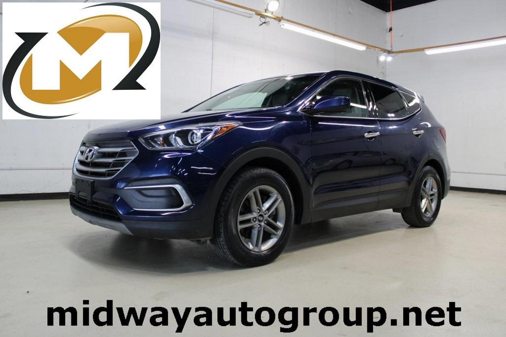 2018 Nightfall Blue /Beige Hyundai Santa Fe Sport 2.4 Base (5XYZT3LB2JG) with an 2.4L I4 DGI DOHC 16V engine, Automatic transmission, located at 15300 Midway Rd., Addison, TX, 75001, (972) 702-0011, 32.958321, -96.838074 - Photo#0