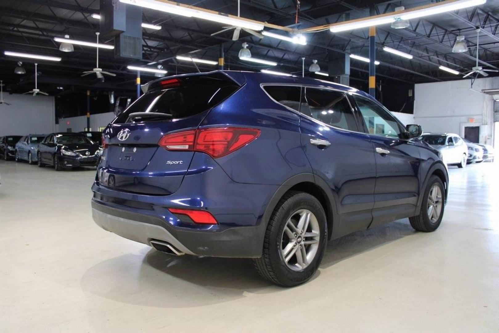 2018 Nightfall Blue /Beige Hyundai Santa Fe Sport 2.4 Base (5XYZT3LB2JG) with an 2.4L I4 DGI DOHC 16V engine, Automatic transmission, located at 15300 Midway Rd., Addison, TX, 75001, (972) 702-0011, 32.958321, -96.838074 - Photo#2