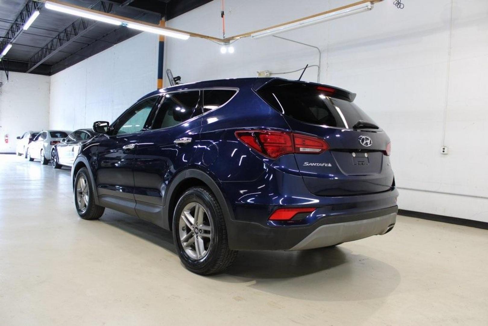 2018 Nightfall Blue /Beige Hyundai Santa Fe Sport 2.4 Base (5XYZT3LB2JG) with an 2.4L I4 DGI DOHC 16V engine, Automatic transmission, located at 15300 Midway Rd., Addison, TX, 75001, (972) 702-0011, 32.958321, -96.838074 - Photo#3