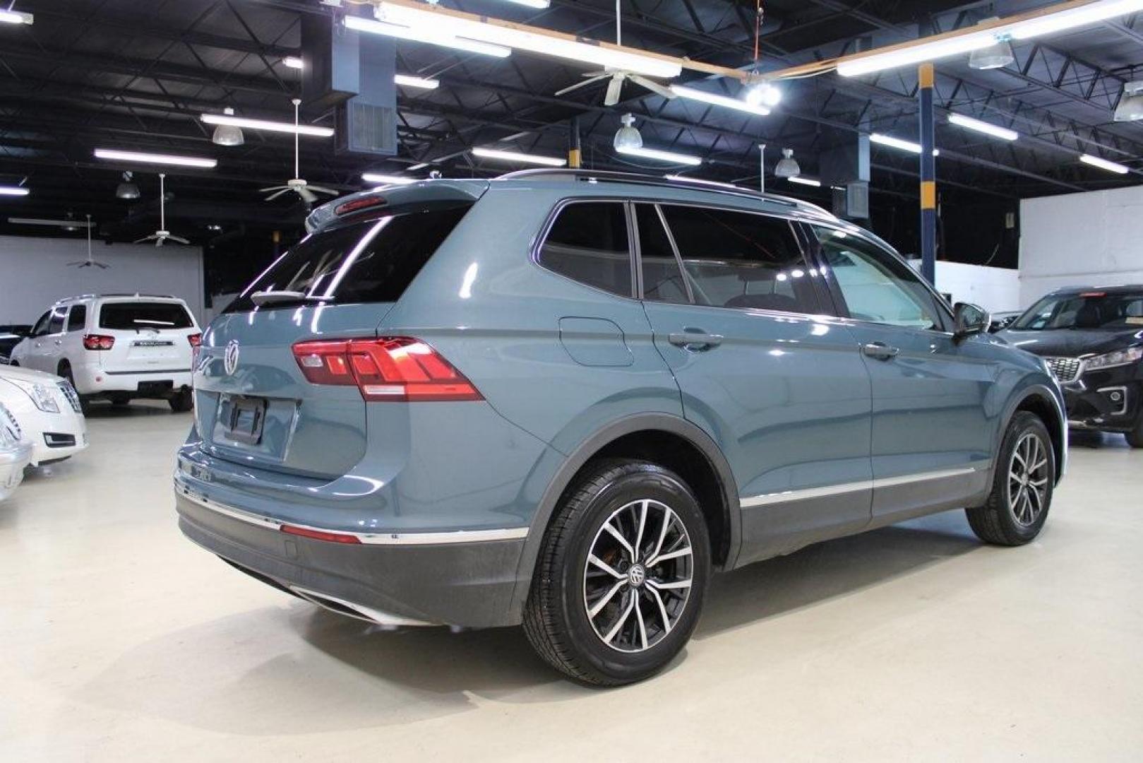 2020 Blue /Saffrano Orange and Black Volkswagen Tiguan 2.0T SE (3VV3B7AX4LM) with an 2.0L TSI DOHC engine, Automatic transmission, located at 15300 Midway Rd., Addison, TX, 75001, (972) 702-0011, 32.958321, -96.838074 - HOME OF THE NO HAGGLE PRICE - WHOLESALE PRICES TO THE PUBLIC!! Tiguan 2.0T SE, 4D Sport Utility, 2.0L TSI DOHC, 8-Speed Automatic with Tiptronic, FWD, Blue.<br><br>Blue 2020 Volkswagen Tiguan 2.0T SE<br><br>Recent Arrival! 22/29 City/Highway MPG<br><br><br>At Midway Auto Group, we strive to provide - Photo#2