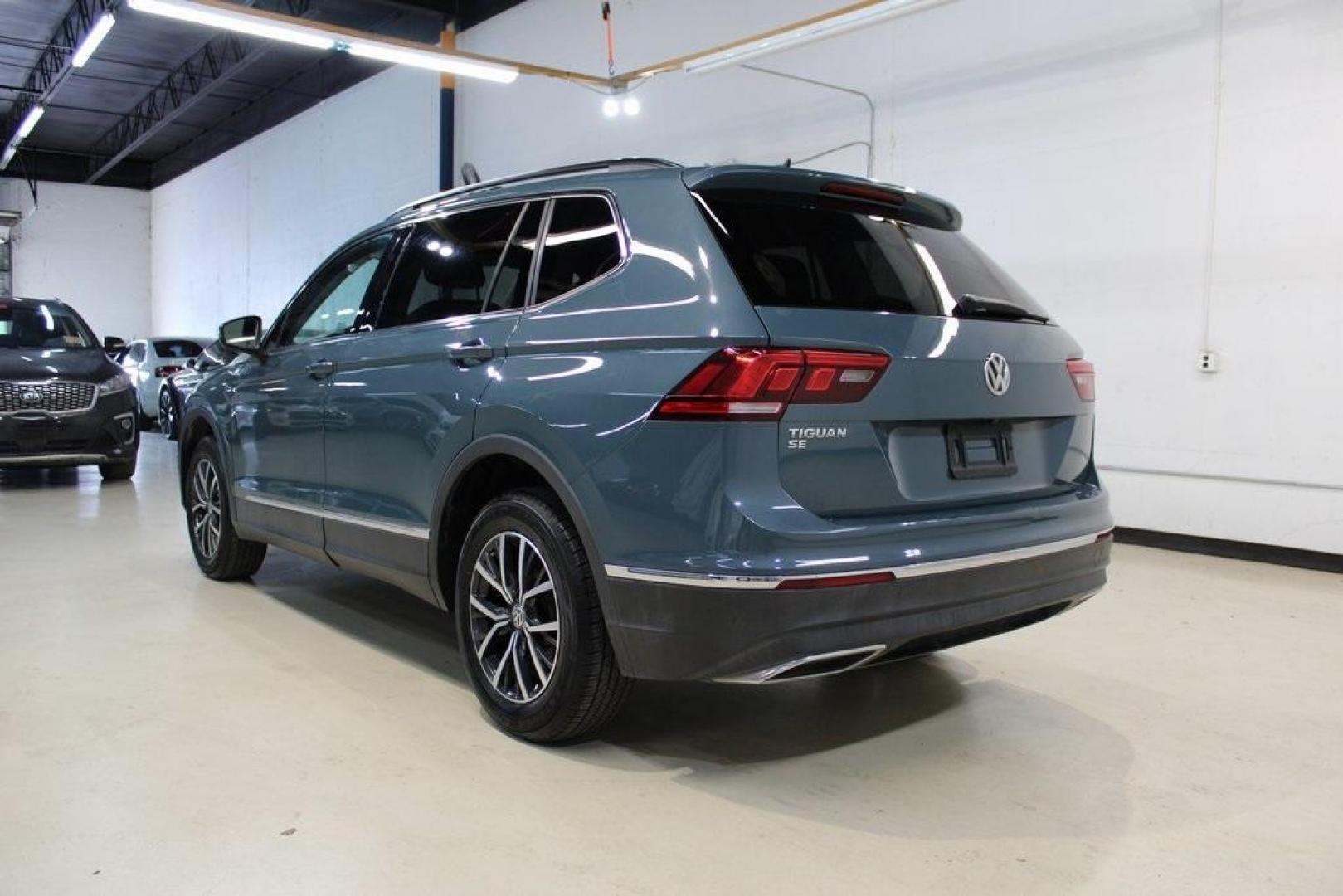 2020 Blue /Saffrano Orange and Black Volkswagen Tiguan 2.0T SE (3VV3B7AX4LM) with an 2.0L TSI DOHC engine, Automatic transmission, located at 15300 Midway Rd., Addison, TX, 75001, (972) 702-0011, 32.958321, -96.838074 - HOME OF THE NO HAGGLE PRICE - WHOLESALE PRICES TO THE PUBLIC!! Tiguan 2.0T SE, 4D Sport Utility, 2.0L TSI DOHC, 8-Speed Automatic with Tiptronic, FWD, Blue.<br><br>Blue 2020 Volkswagen Tiguan 2.0T SE<br><br>Recent Arrival! 22/29 City/Highway MPG<br><br><br>At Midway Auto Group, we strive to provide - Photo#3