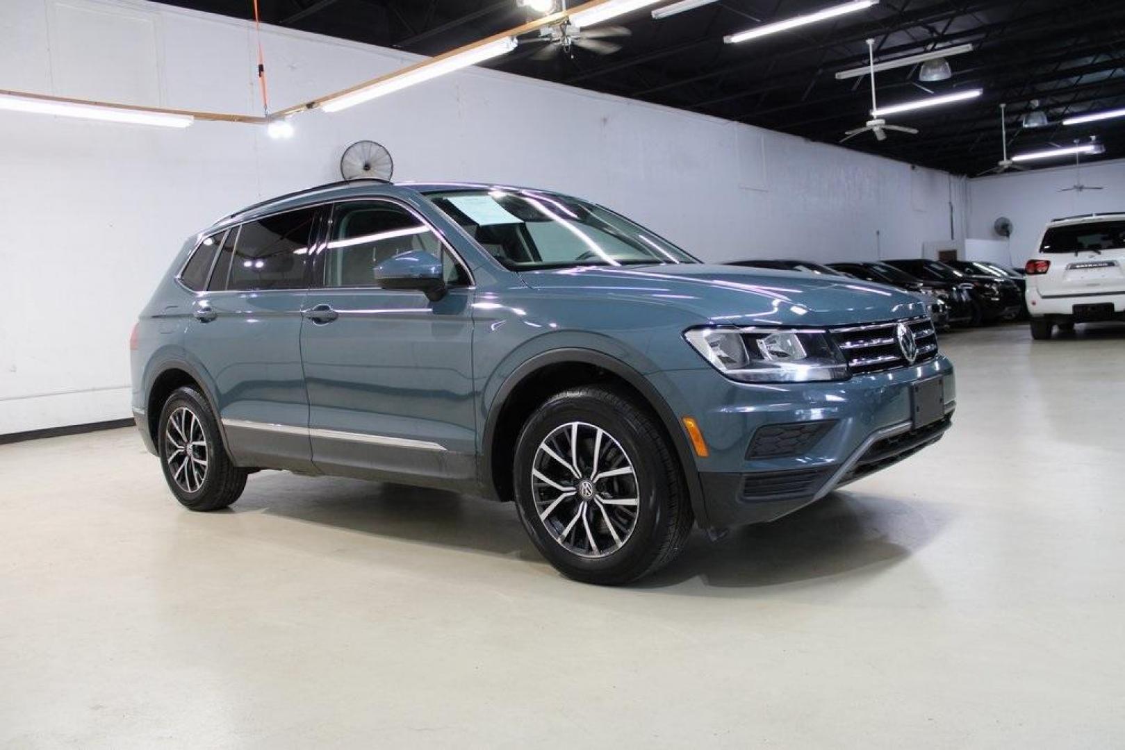 2020 Blue /Saffrano Orange and Black Volkswagen Tiguan 2.0T SE (3VV3B7AX4LM) with an 2.0L TSI DOHC engine, Automatic transmission, located at 15300 Midway Rd., Addison, TX, 75001, (972) 702-0011, 32.958321, -96.838074 - HOME OF THE NO HAGGLE PRICE - WHOLESALE PRICES TO THE PUBLIC!! Tiguan 2.0T SE, 4D Sport Utility, 2.0L TSI DOHC, 8-Speed Automatic with Tiptronic, FWD, Blue.<br><br>Blue 2020 Volkswagen Tiguan 2.0T SE<br><br>Recent Arrival! 22/29 City/Highway MPG<br><br><br>At Midway Auto Group, we strive to provide - Photo#6