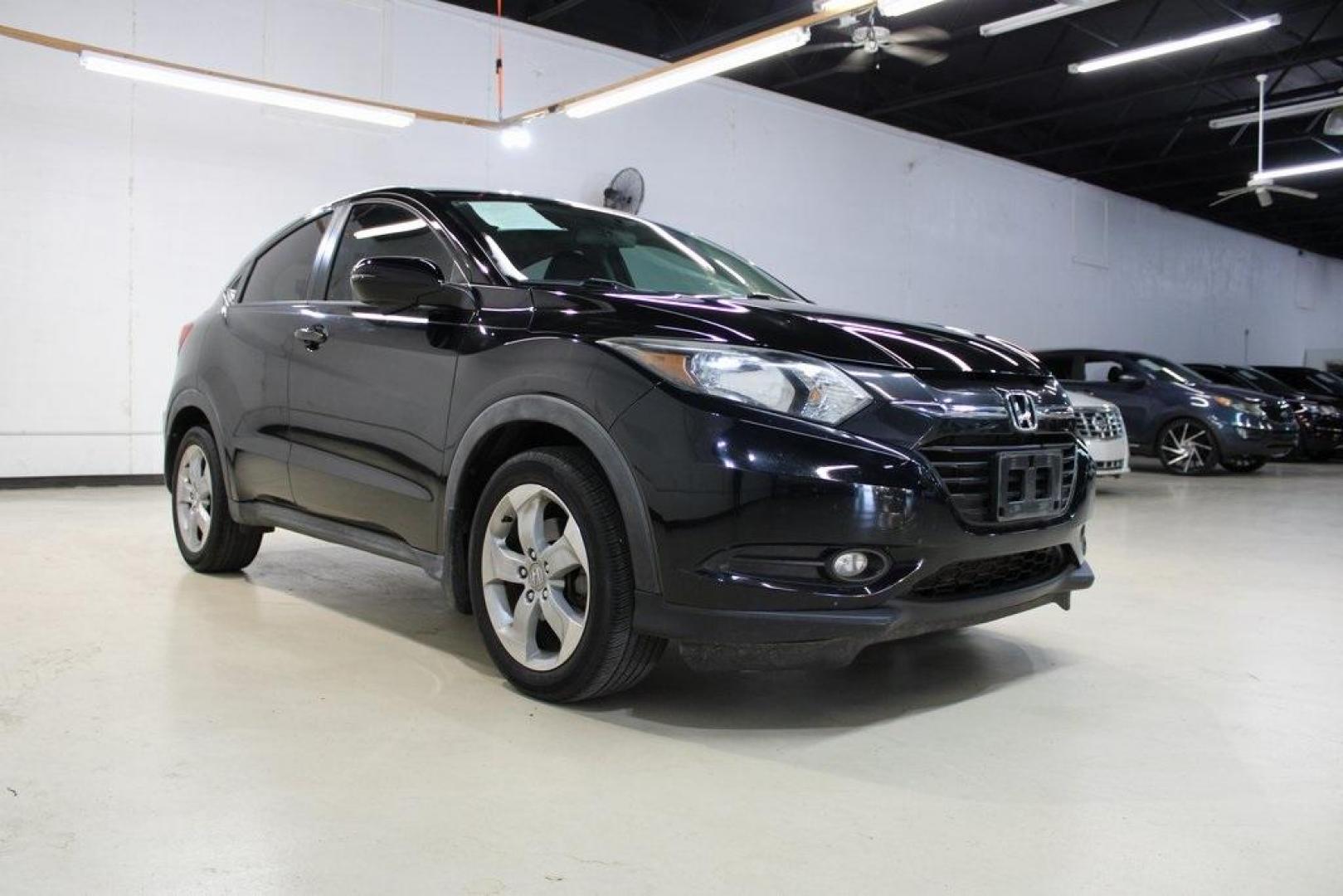 2016 Crystal Black Pearl Honda HR-V EX (3CZRU5G52GM) with an 1.8L I4 SOHC 16V i-VTEC engine, Manual transmission, located at 15300 Midway Rd., Addison, TX, 75001, (972) 702-0011, 32.958321, -96.838074 - Photo#1