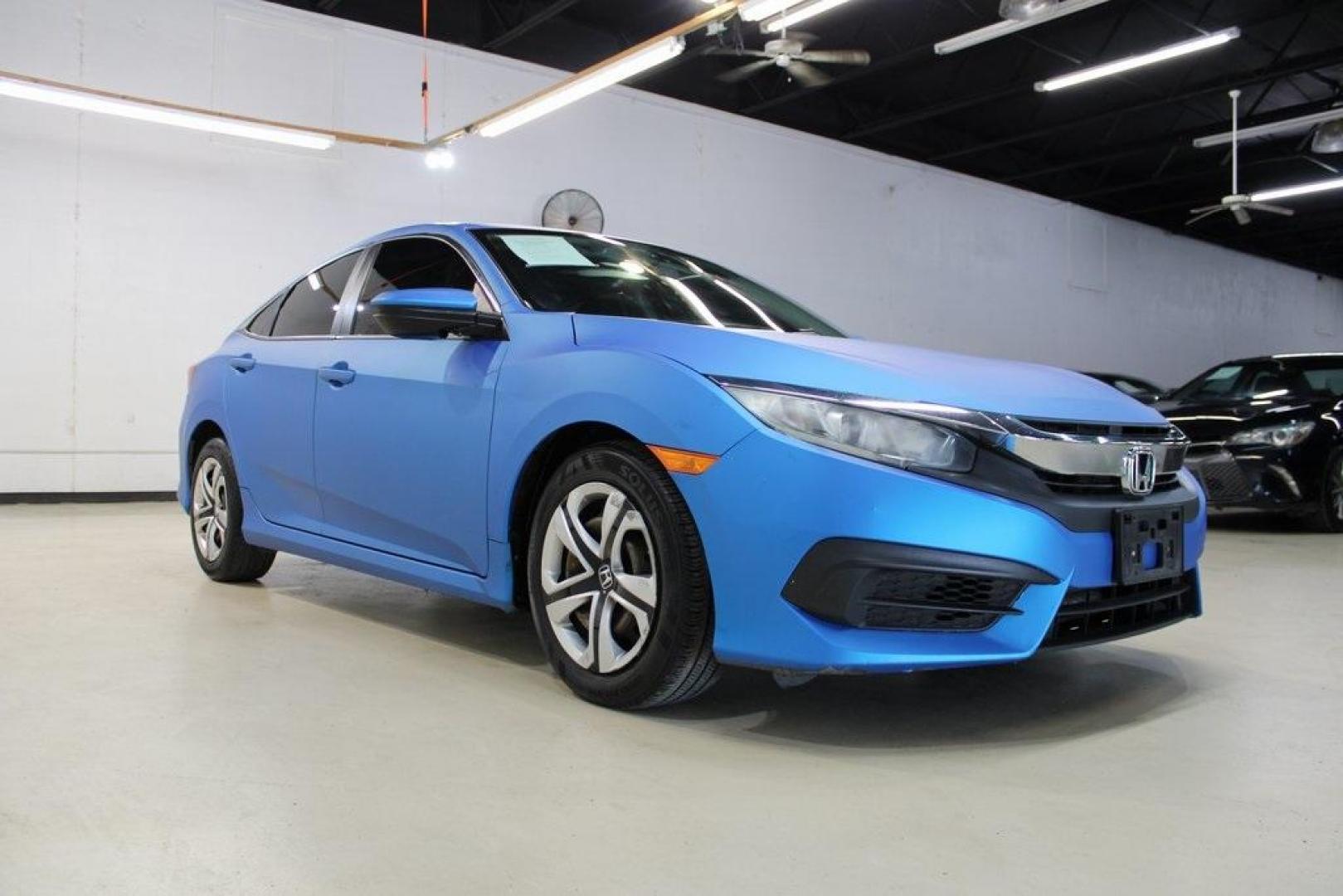 2016 Modern Steel Metallic /Gray Honda Civic LX (19XFC2F59GE) with an 2.0L I4 DOHC 16V i-VTEC engine, CVT transmission, located at 15300 Midway Rd., Addison, TX, 75001, (972) 702-0011, 32.958321, -96.838074 - HOME OF THE NO HAGGLE PRICE - WHOLESALE PRICES TO THE PUBLIC!! Civic LX, 4D Sedan, 2.0L I4 DOHC 16V i-VTEC, CVT, FWD, Gray, Gray Cloth.<br><br>Gray 2016 Honda Civic LX<br><br>31/41 City/Highway MPG<br><br>Awards:<br> * 2016 IIHS Top Safety Pick+ (When equipped with honda sensing) * NACTOY 2016 No - Photo#1