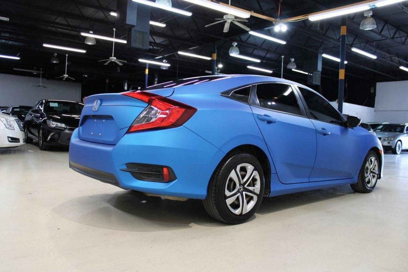 2016 Modern Steel Metallic /Gray Honda Civic LX (19XFC2F59GE) with an 2.0L I4 DOHC 16V i-VTEC engine, CVT transmission, located at 15300 Midway Rd., Addison, TX, 75001, (972) 702-0011, 32.958321, -96.838074 - HOME OF THE NO HAGGLE PRICE - WHOLESALE PRICES TO THE PUBLIC!! Civic LX, 4D Sedan, 2.0L I4 DOHC 16V i-VTEC, CVT, FWD, Gray, Gray Cloth.<br><br>Gray 2016 Honda Civic LX<br><br>31/41 City/Highway MPG<br><br>Awards:<br> * 2016 IIHS Top Safety Pick+ (When equipped with honda sensing) * NACTOY 2016 No - Photo#2