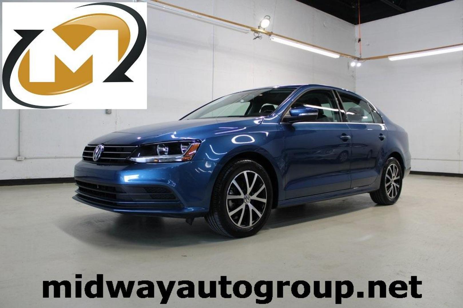 2017 Silk Blue Metallic Volkswagen Jetta 1.4T SE (3VWDB7AJXHM) with an 1.4L TSI engine, Automatic transmission, located at 15300 Midway Rd., Addison, TX, 75001, (972) 702-0011, 32.958321, -96.838074 - HOME OF THE NO HAGGLE PRICE - WHOLESALE PRICES TO THE PUBLIC!!<br><br>Blue 2017 Volkswagen Jetta 1.4T SE<br><br>Recent Arrival! 28/38 City/Highway MPG<br><br>Awards:<br> * 2017 IIHS Top Safety Pick+ * 2017 KBB.com 10 Coolest New Cars Under $18,000 * 2017 KBB.com 10 Best Used Compact Cars Under - Photo#0